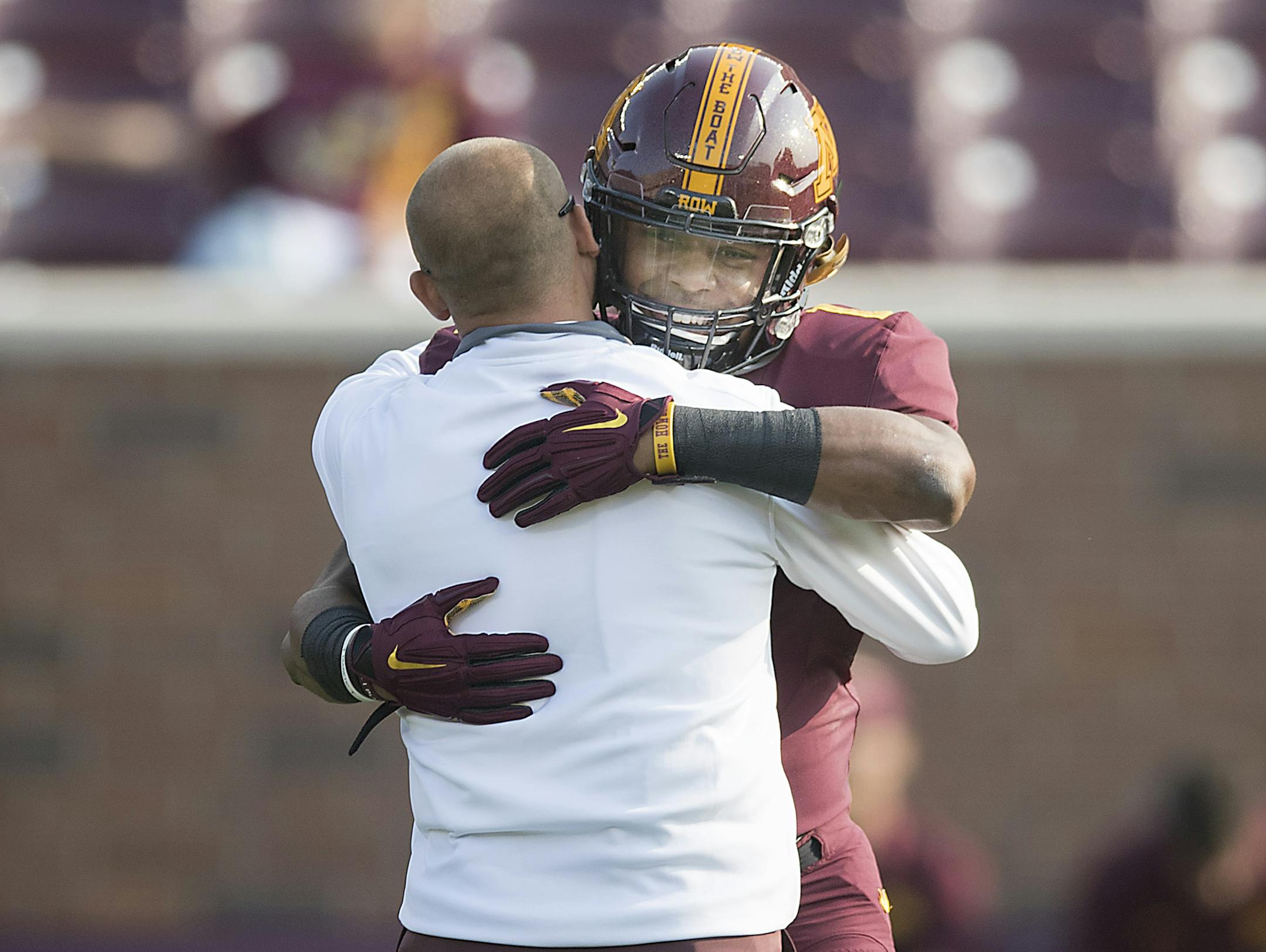 Gophers Coach P.J. Fleck hugged running back Rodney Smith before the Gophers faced Buffalo in the 2017 season opener.
