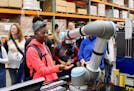 Students from Minneapolis Roosevelt High School attend a past Manufacturing Day event at Graco. The company is participating in Minnesota Manufacturin