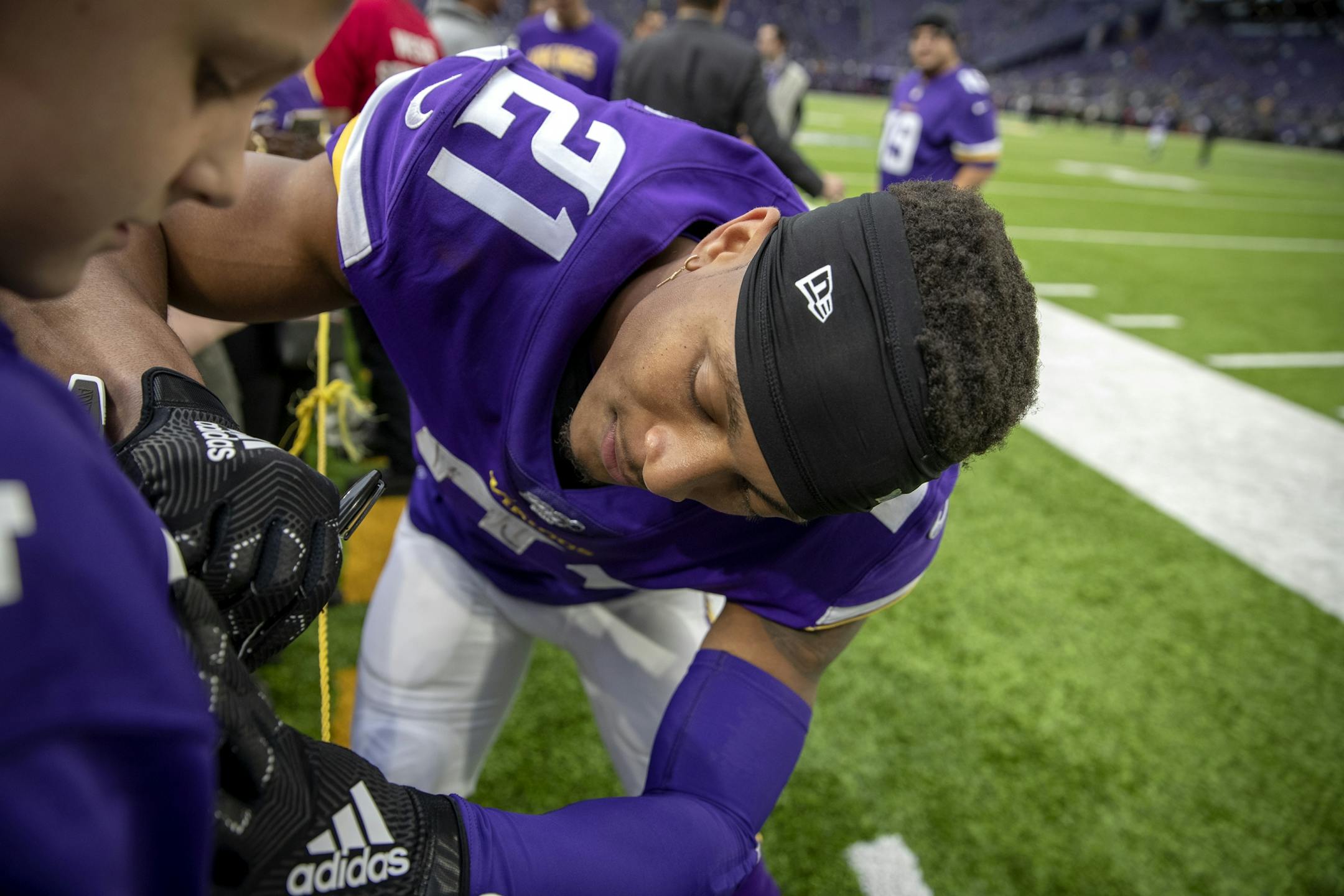 Vikings cornerback Mike Hughes treated a few fans with an autograph before the game.