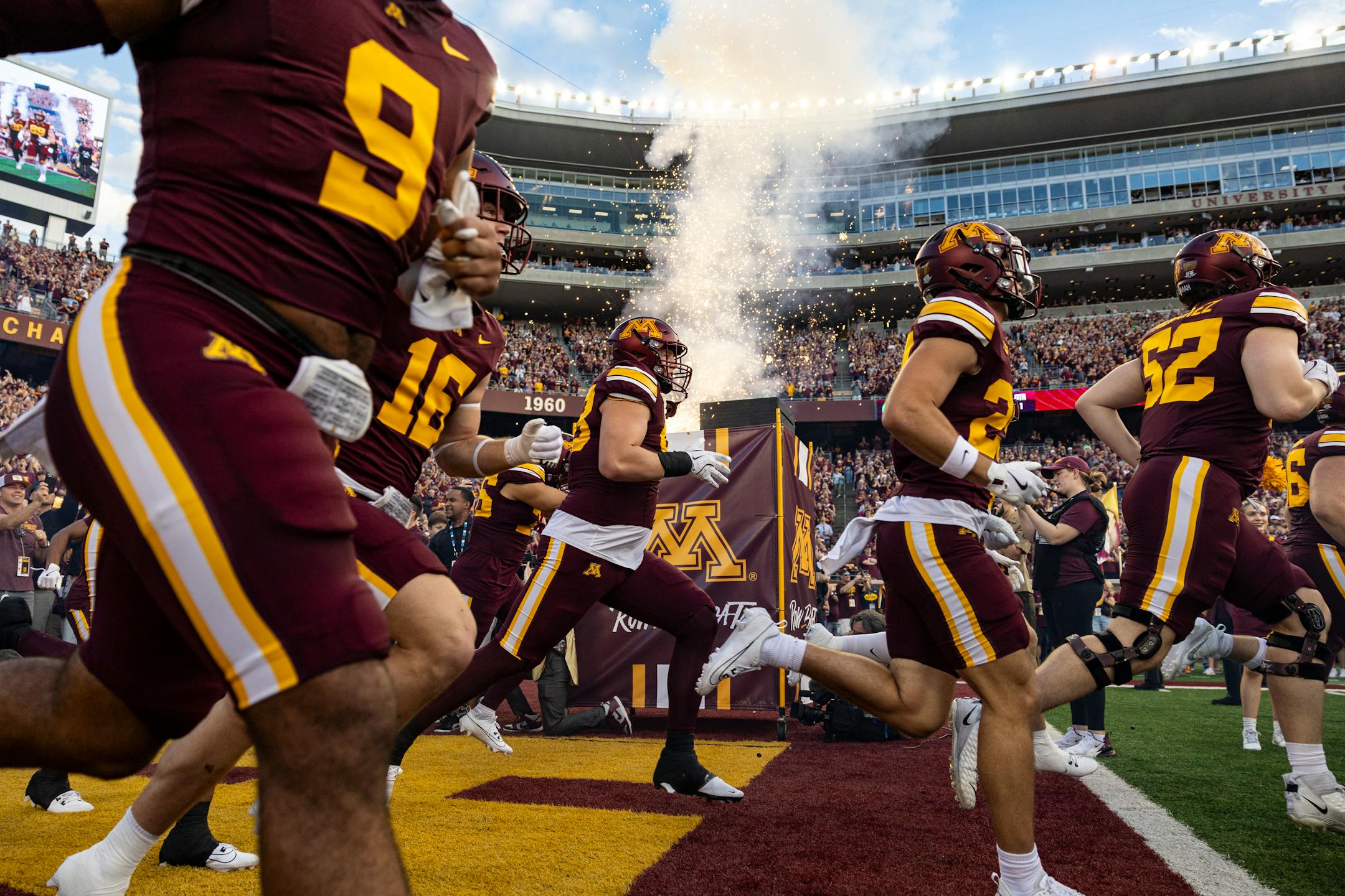 The Minnesota Gophers run onto the field in the first quarter at Huntington Bank Stadium in Minneapolis on Sept. 21, 2024