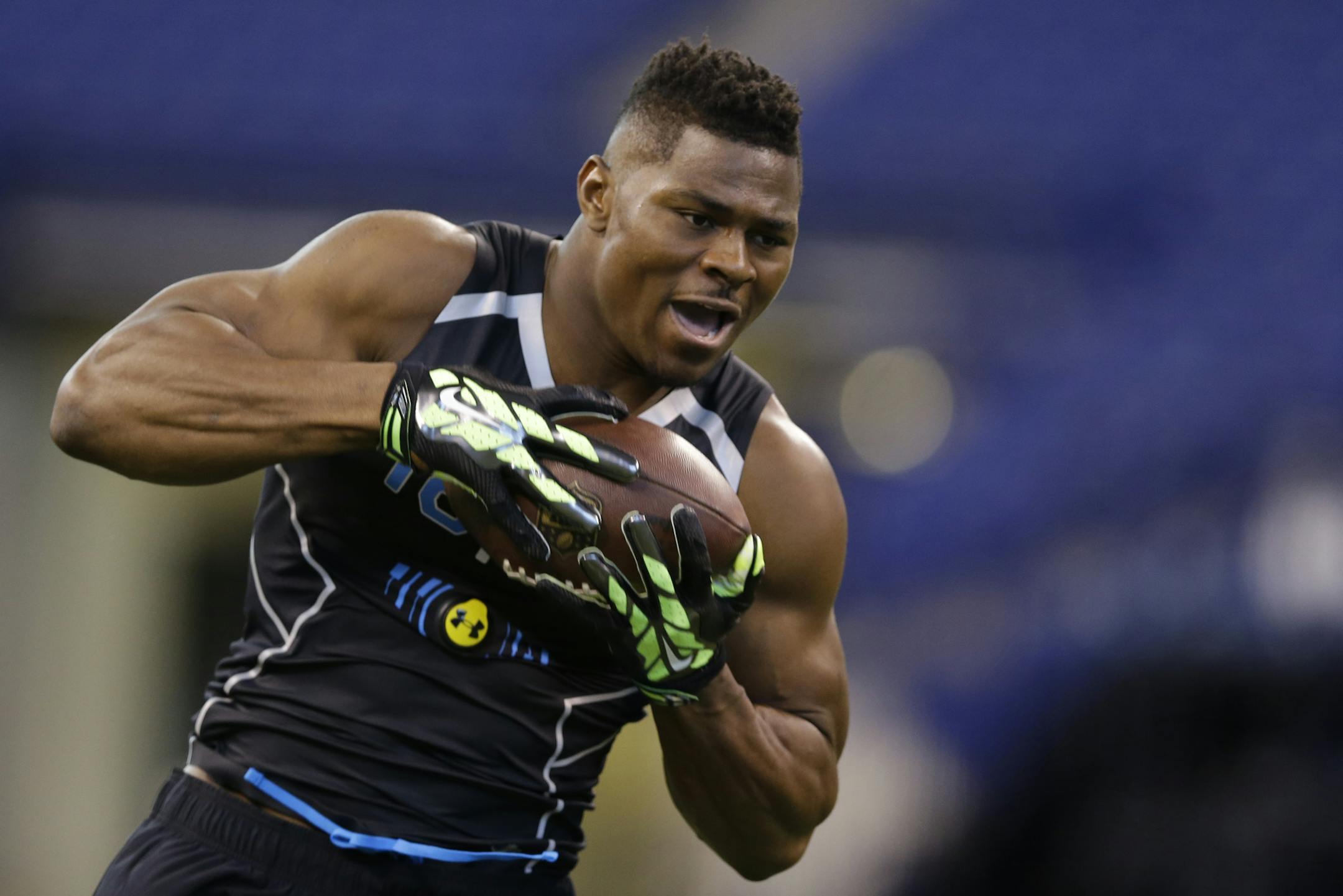 Buffalo linebacker Khalil Mack runs a drill at the NFL football scouting combine in Indianapolis, Monday, Feb. 24, 2014. (AP Photo/Michael Conroy) ORG XMIT: NYOTK