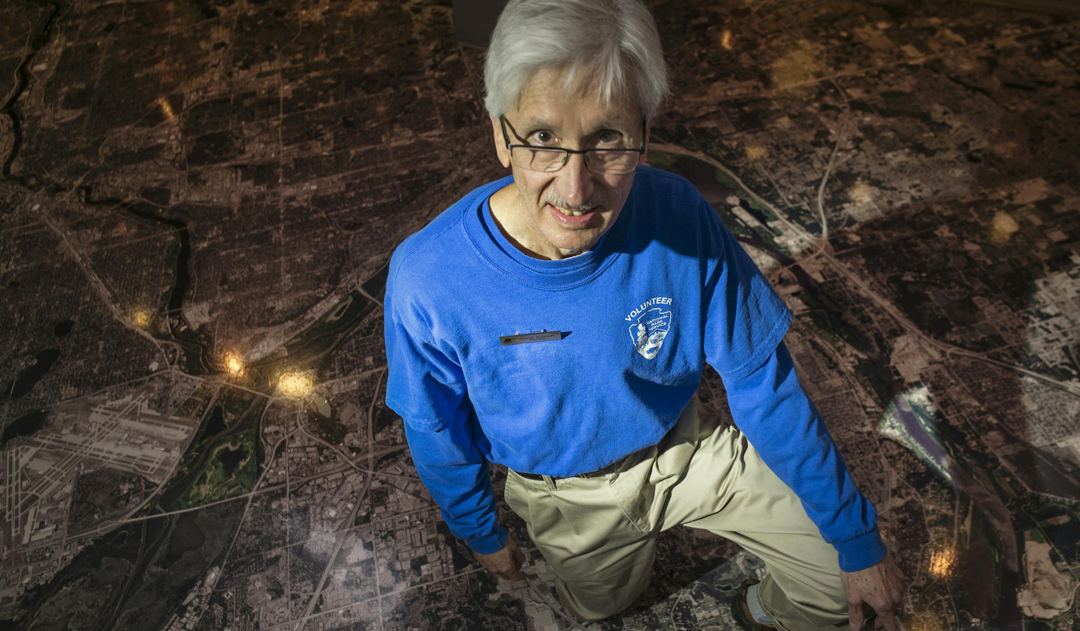 Dave Schmidt is a graduate of the Minnesota Master Naturalist program.] His expertise lies with "Big Woods, Big Rivers" as well as "North Woods, Great Lakes." He is standing on a giant map of the metro Mississippi river system.] Richard Tsong-Taatarii/rtsong-taatarii@startribune.com