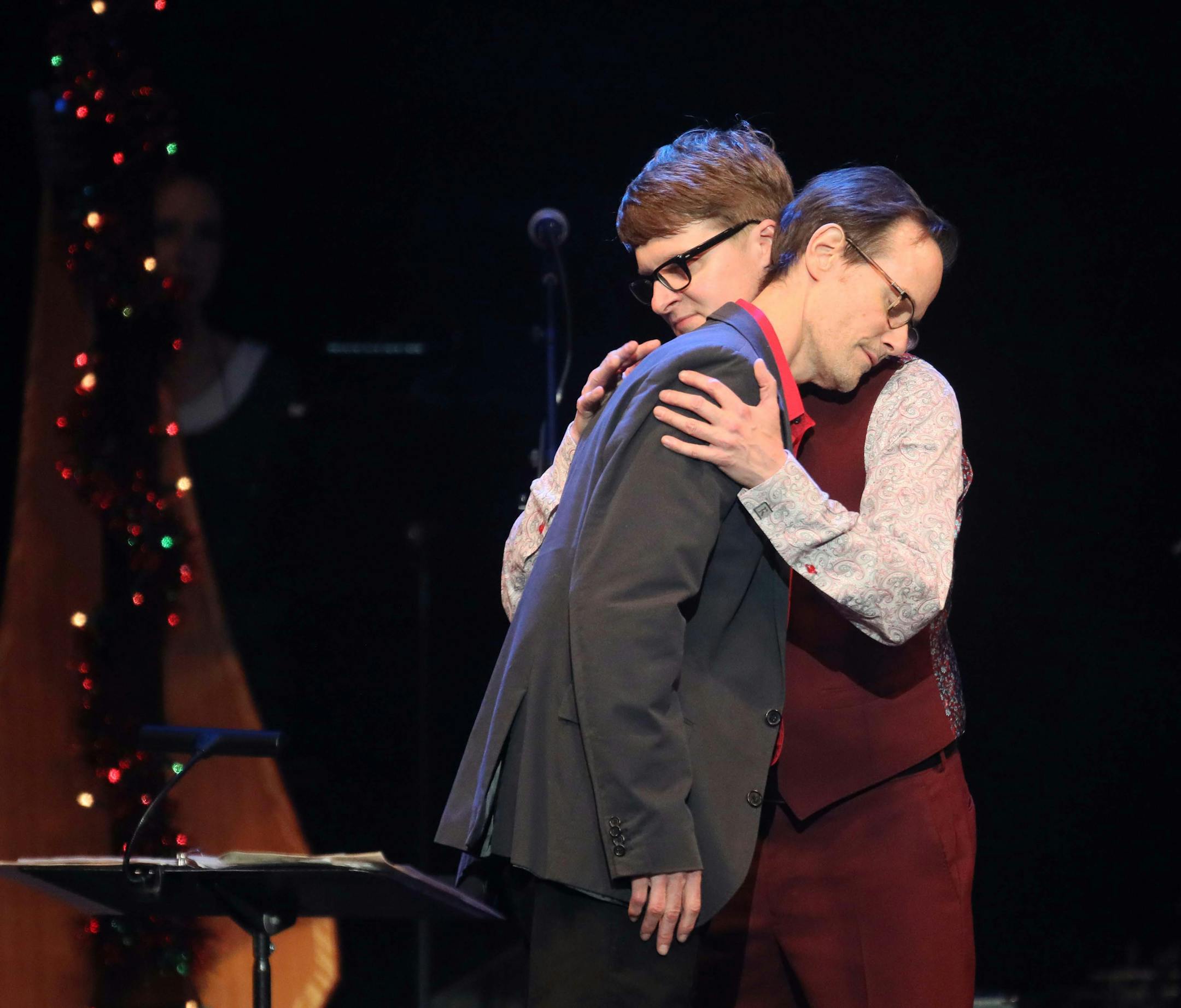 The New Standards holiday concert featuring Chan Poling, vocals John Munson, on bass and Steve Roehm on vibes hugging guest performer Matt Wilson at the State Theatre Friday, Dec. 7, 2018, in Minneapolis, MN. DAVID JOLES ï david.joles@startribune.com Review of the first of three holiday concerts by the New Standards at State Theatre