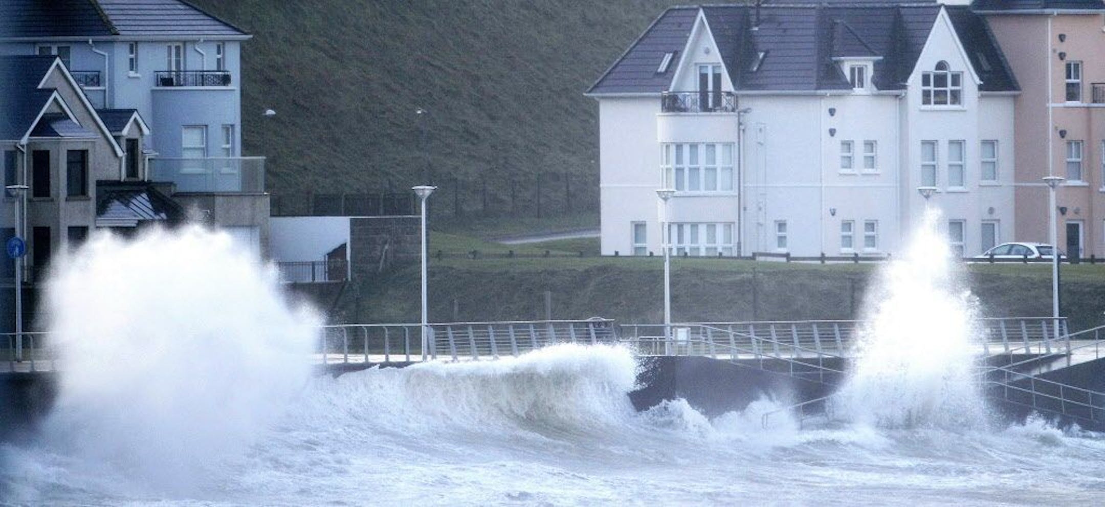 Waves crash against the sea defenses in Portrush, Northern Ireland, Thursday, Jan. 15, 2015.