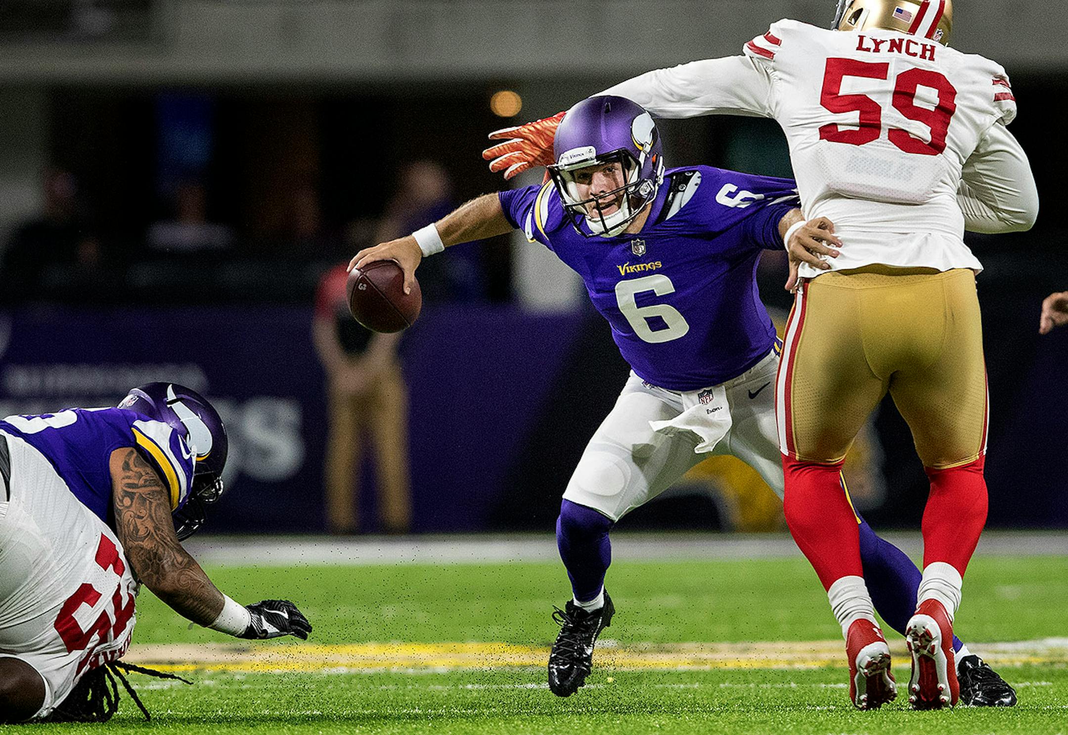 Vikings quarterback Taylor Heinicke avoided being sacked by Aaron Lynch in the fourth quarter.