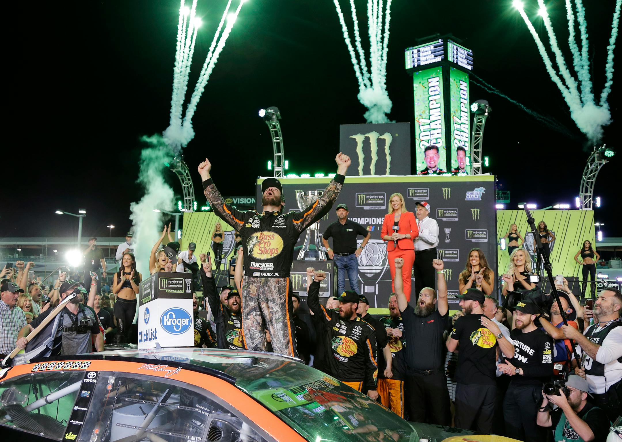 Martin Truex Jr. celebrates in Victory Lane after winning the NASCAR Cup Series auto race and season championship at Homestead-Miami Speedway in Homestead, Fla., Sunday, Nov. 19, 2017. (AP Photo/Terry Renna)