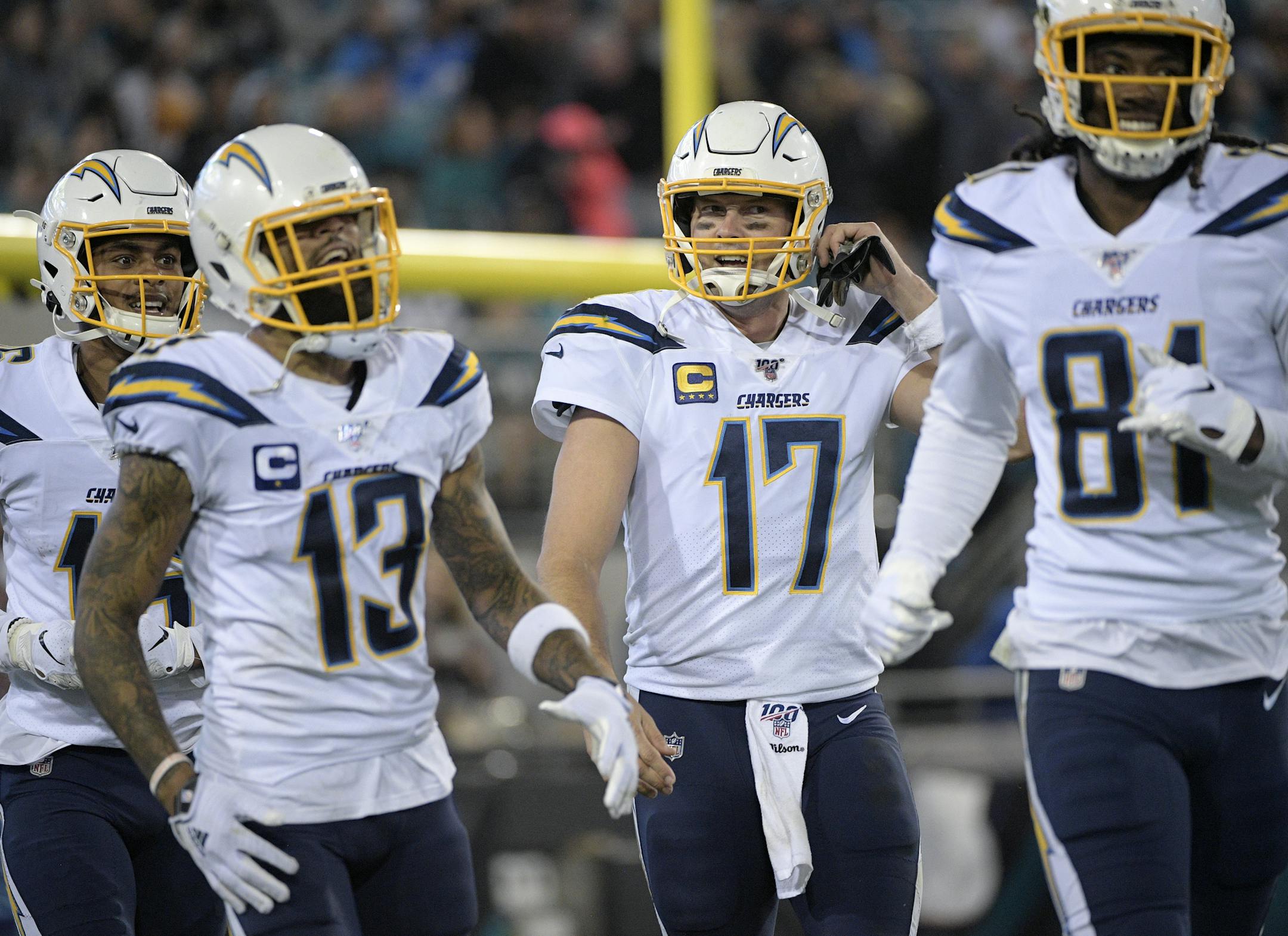 Los Angeles Chargers quarterback Philip Rivers (17) celebrates after throwing a 44-yard touchdown pass to wide receiver Mike Williams (81) during the second half of an NFL football game against the Jacksonville Jaguars Sunday, Dec. 8, 2019, in Jacksonville, Fla. (AP Photo/Phelan M. Ebenhack)