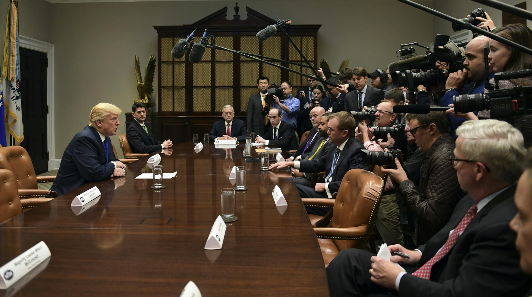 President Donald Trump, left, speaks in the Roosevelt Room of the White House in Washington, Tuesday, Nov. 28, 2017, during a meeting with Republican congressional leaders, including House Speaker Paul Ryan of Wis., second from left. (AP Photo/Susan Walsh)