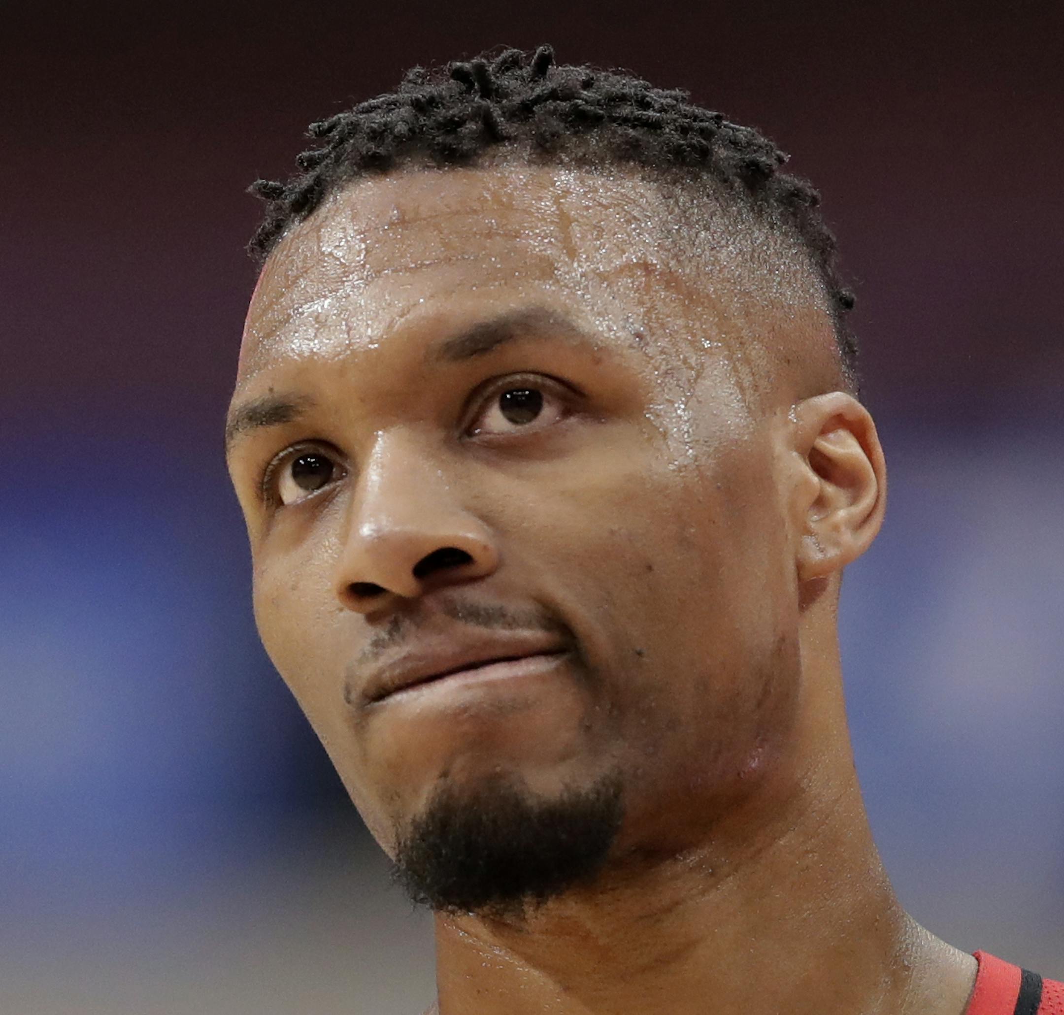 Portland Trail Blazers guard Damian Lillard walks up court in the second half of an NBA basketball game against the Dallas Mavericks in Dallas, Tuesday, April 3, 2018. Lillard lead all scoring with 29 points in the 115-109 loss to the Mavericks. (AP Photo/Tony Gutierrez)