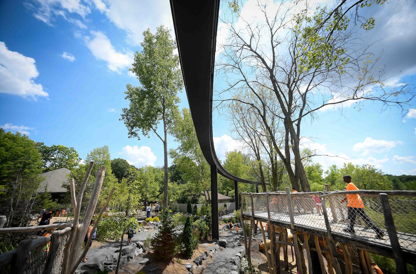 The defunct monorail track passes above the Hanifl Family Wild Woods Play Area as seen Thursday afternoon. ] AARON LAVINSKY &#xef; aaron.lavinsky@startribune.com Zoo director John Frawley dreams of converting the defunct Monorail into a boardwalk overlooking the exhibits (think NYC's Hi-line) and partnering with the DNR, Girl Scouts and others to provide camping opportunities on the zoo's underutilized land. It's all part of a massive push to better connect Minnesotans with nature. We photograph