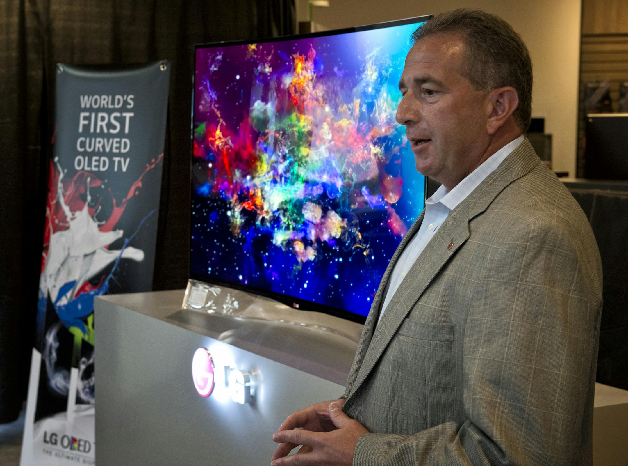 LG director of product development Tim Alessi unveiled the new 55-inch LG curved OLED HDTV Monday in the Best Buy Richfield store.