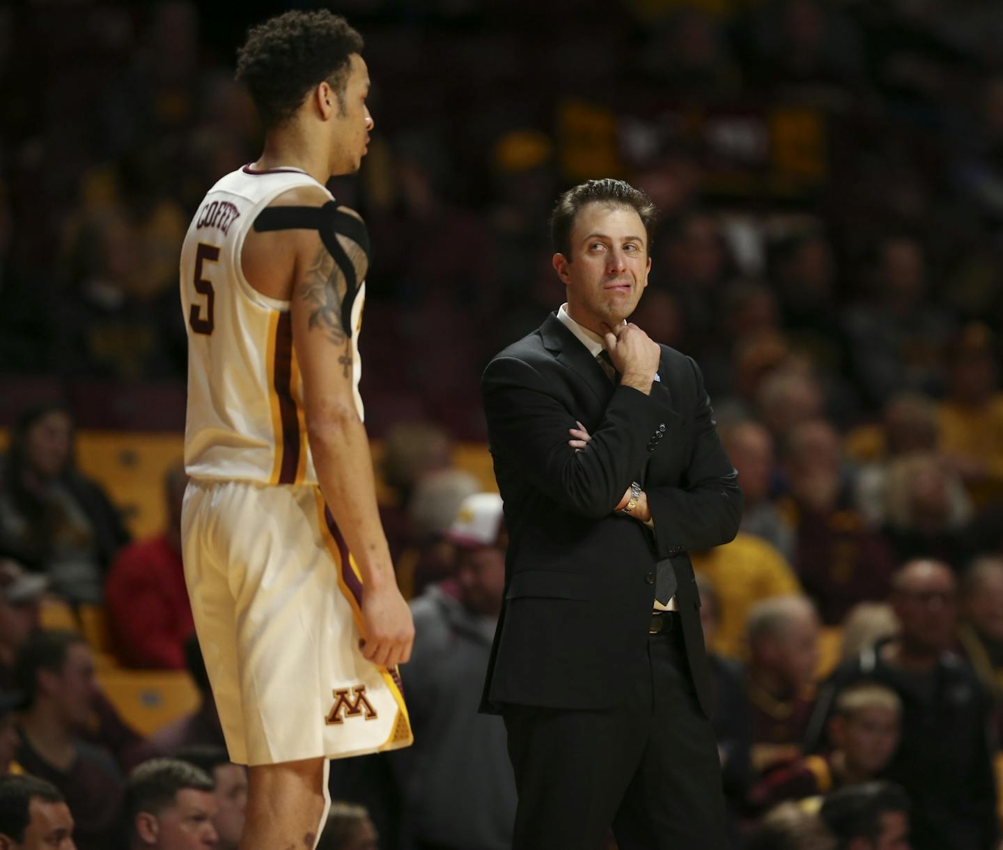 Gophers head coach Richard Pitino stood near guard Amir Coffey as he headed to the bench late in the Minnesota loss.