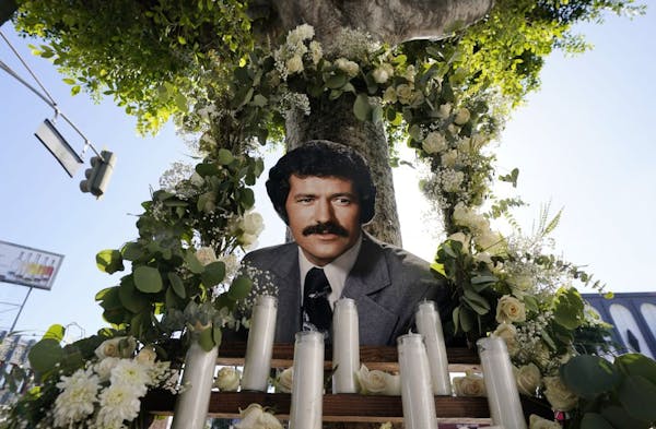 A shrine to the late "Jeopardy" quiz show host Alex Trebek is pictured near his star on the Hollywood Walk of Fame, Monday, Nov. 9, 2020, in Los Angel