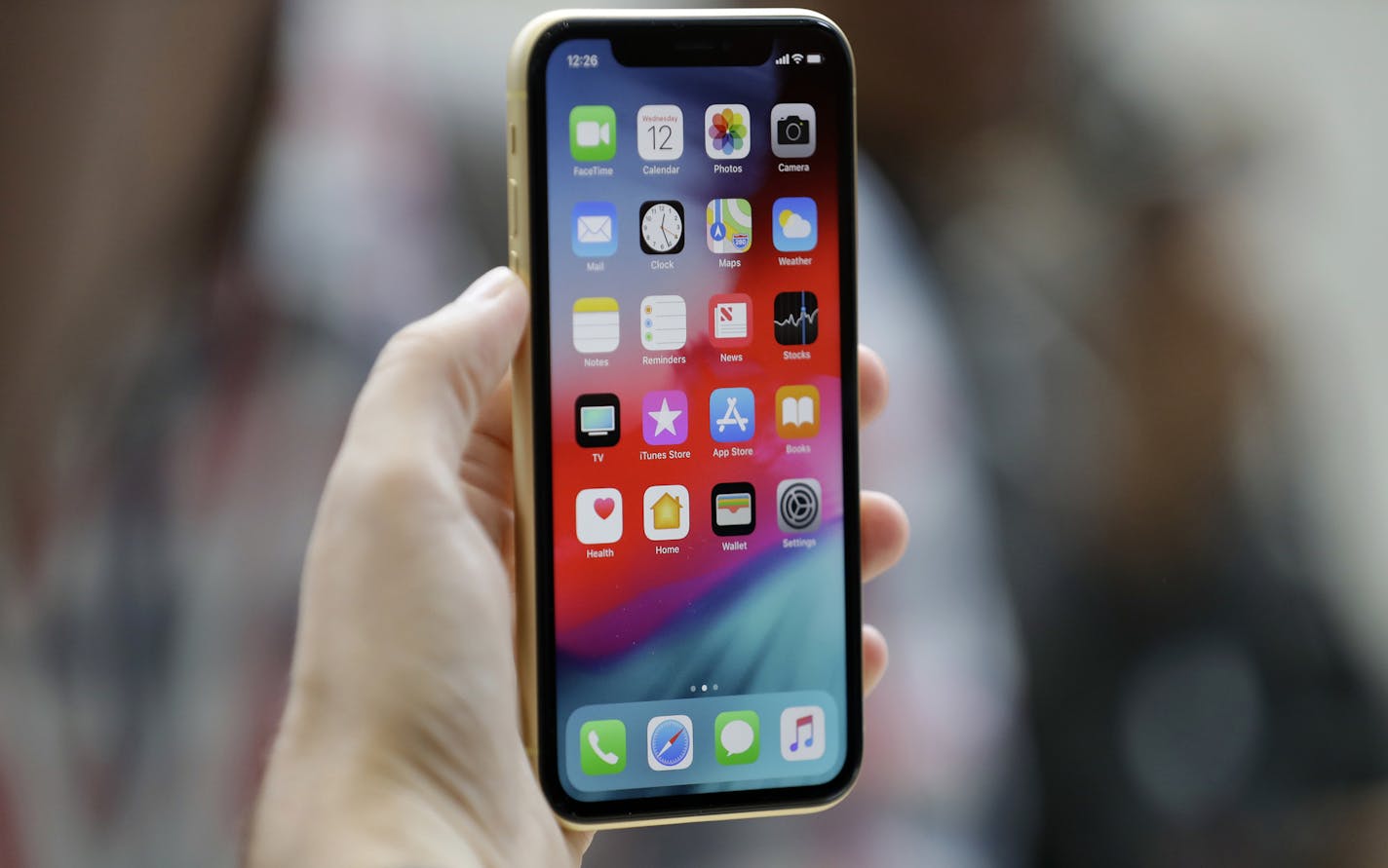 FILE - This Sept. 12, 2018, file photo shows an Apple iPhone XR on display at the Steve Jobs Theater after an event to announce new products, in Cupertino, Calif. Suspected nation-state hackers used malware-laden websites to infect iPhones with spyware in what security researchers are calling the worst general security failure yet affecting the Apple devices. Announced late Thursday, Aug. 29, 2019, by Google researchers, the vulnerabilities were quietly fixed by Apple in February but only after