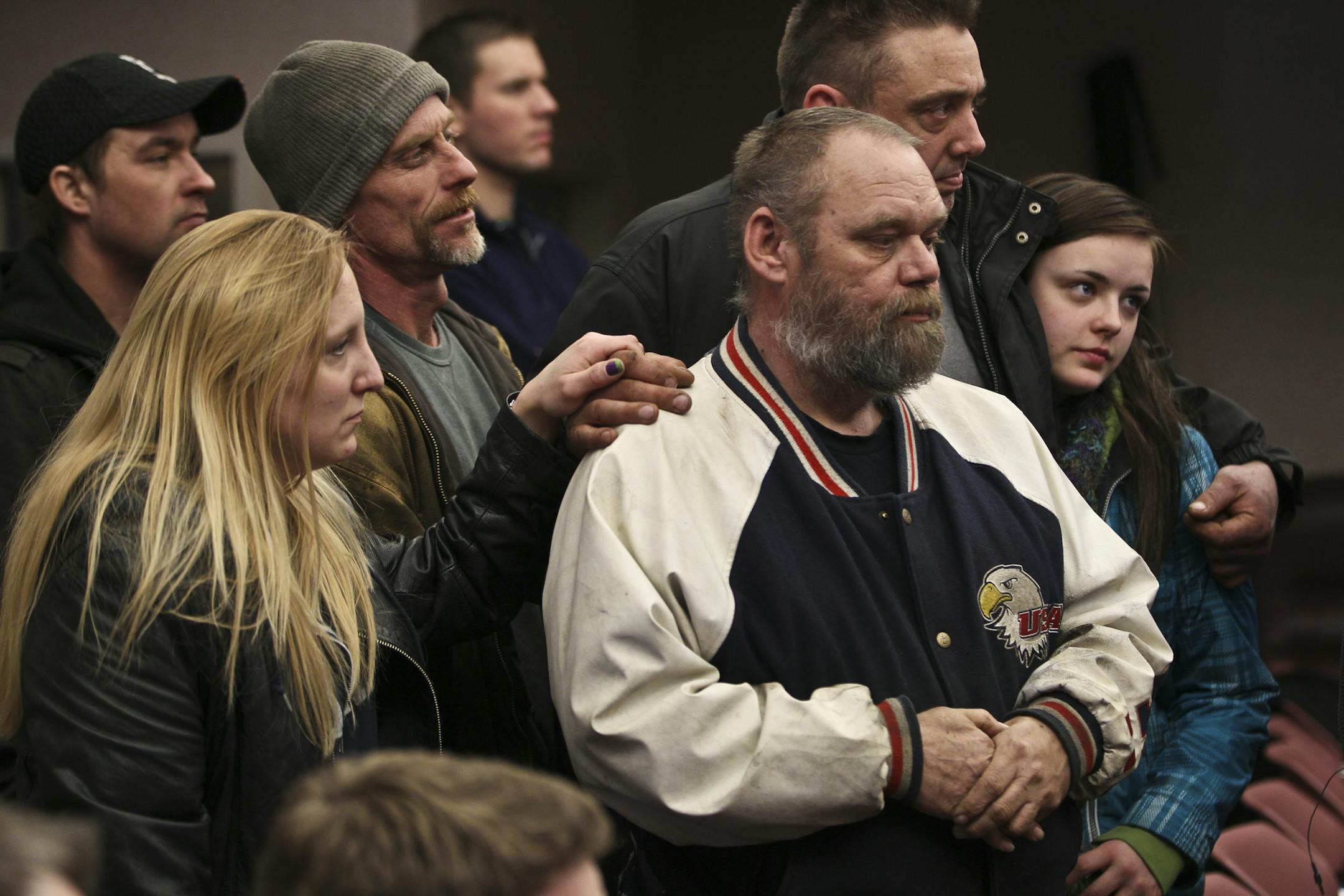 Family and friends of Anna Hurd, including her father (the tall man in back) listened during a press conference at the Maplewood Police Department on the arrest of a minor in her murder on Friday, March 1, 2013, Maplewood, Minn. ] (RENEE JONES SCHNEIDER * reneejones@startribune.com) Don;t have father's name, Kare11 id him to me as her father.