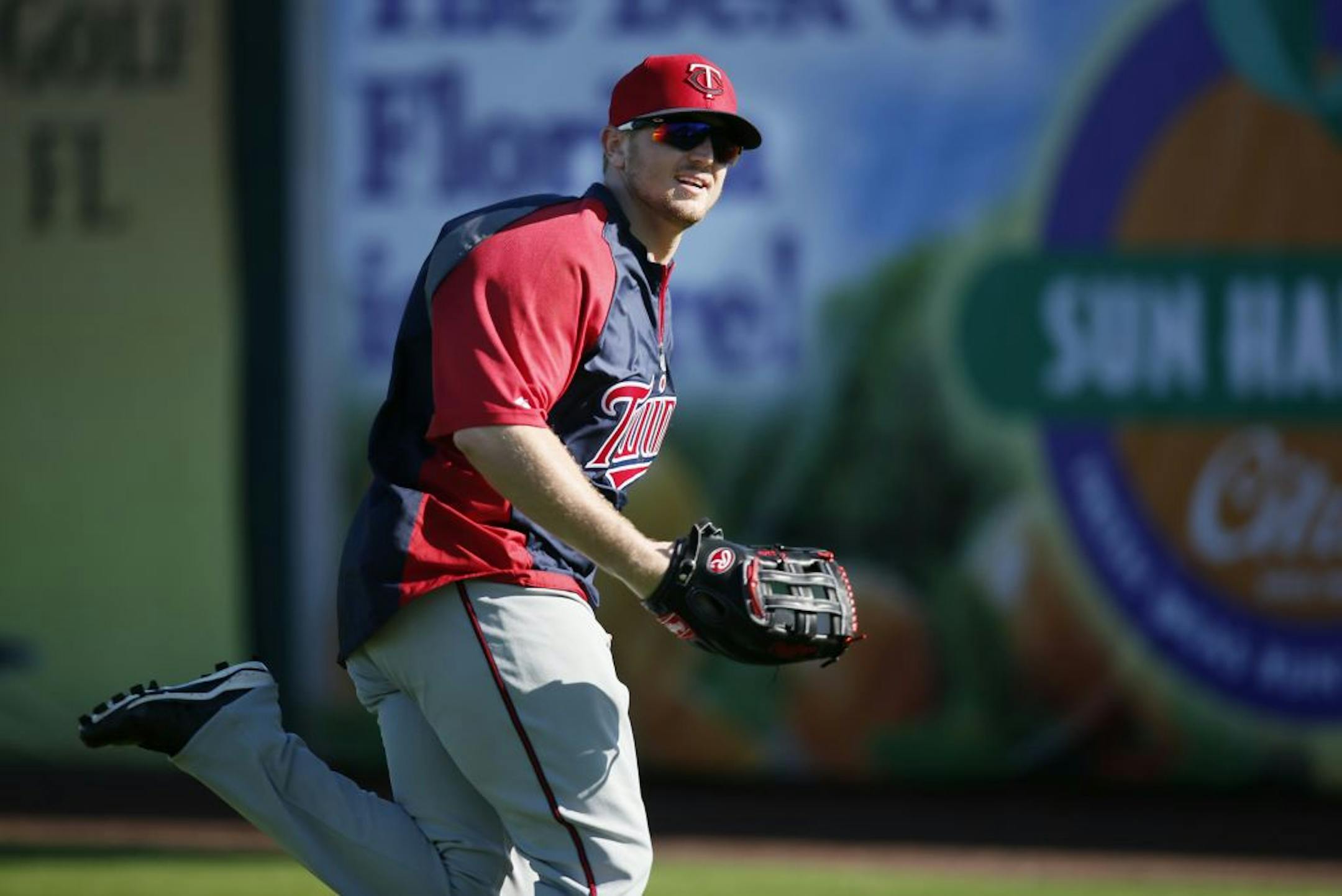 Chris Parmelee made some throws from right field durning practice Wednesday at Lee County Sports Complex in Fort Myers, FL.
