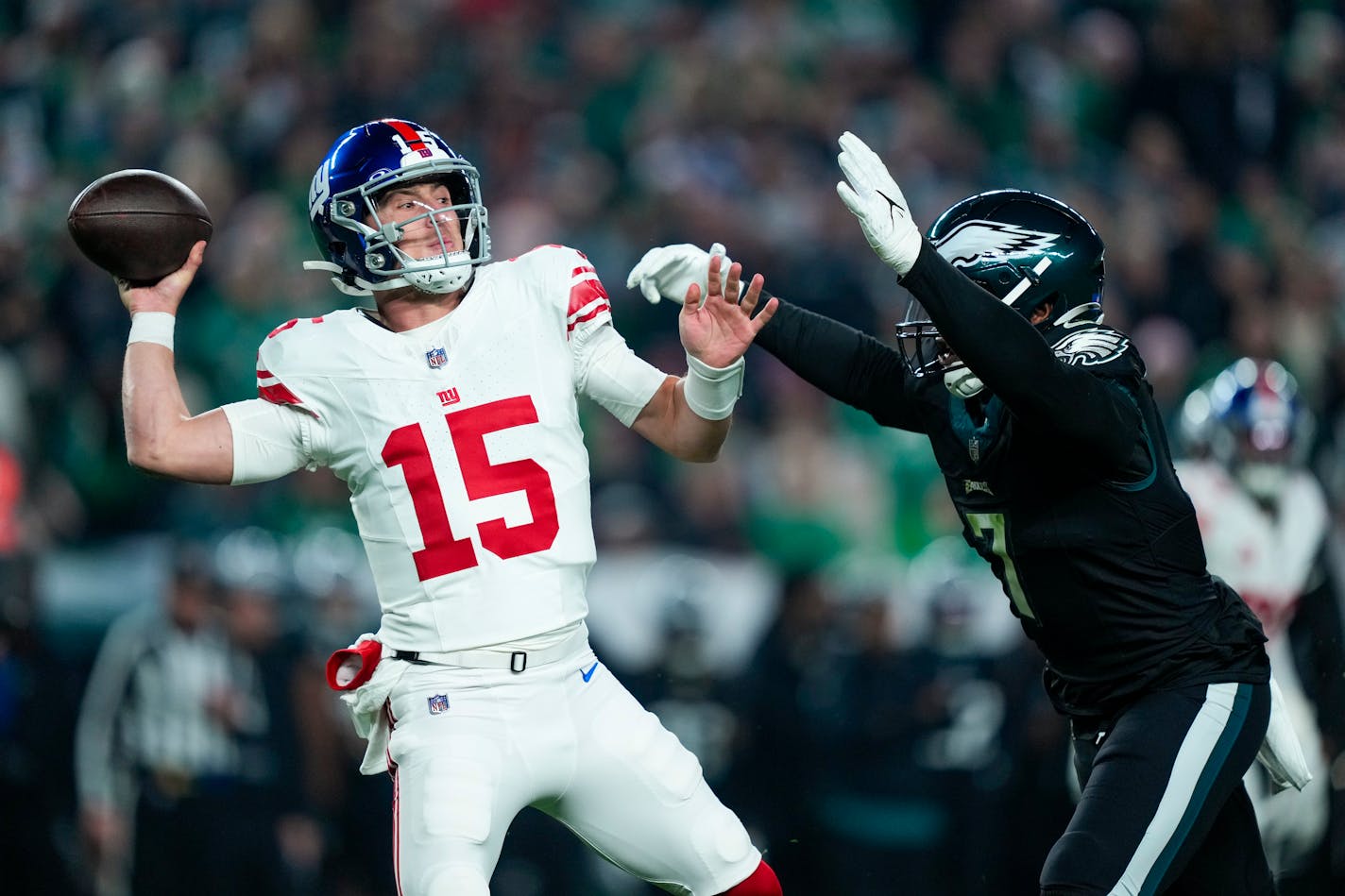 New York Giants quarterback Tommy DeVito plays against the Philadelphia Eagles during the first half of an NFL football game Monday, Dec. 25, 2023, in Philadelphia. (AP Photo/Matt Rourke)