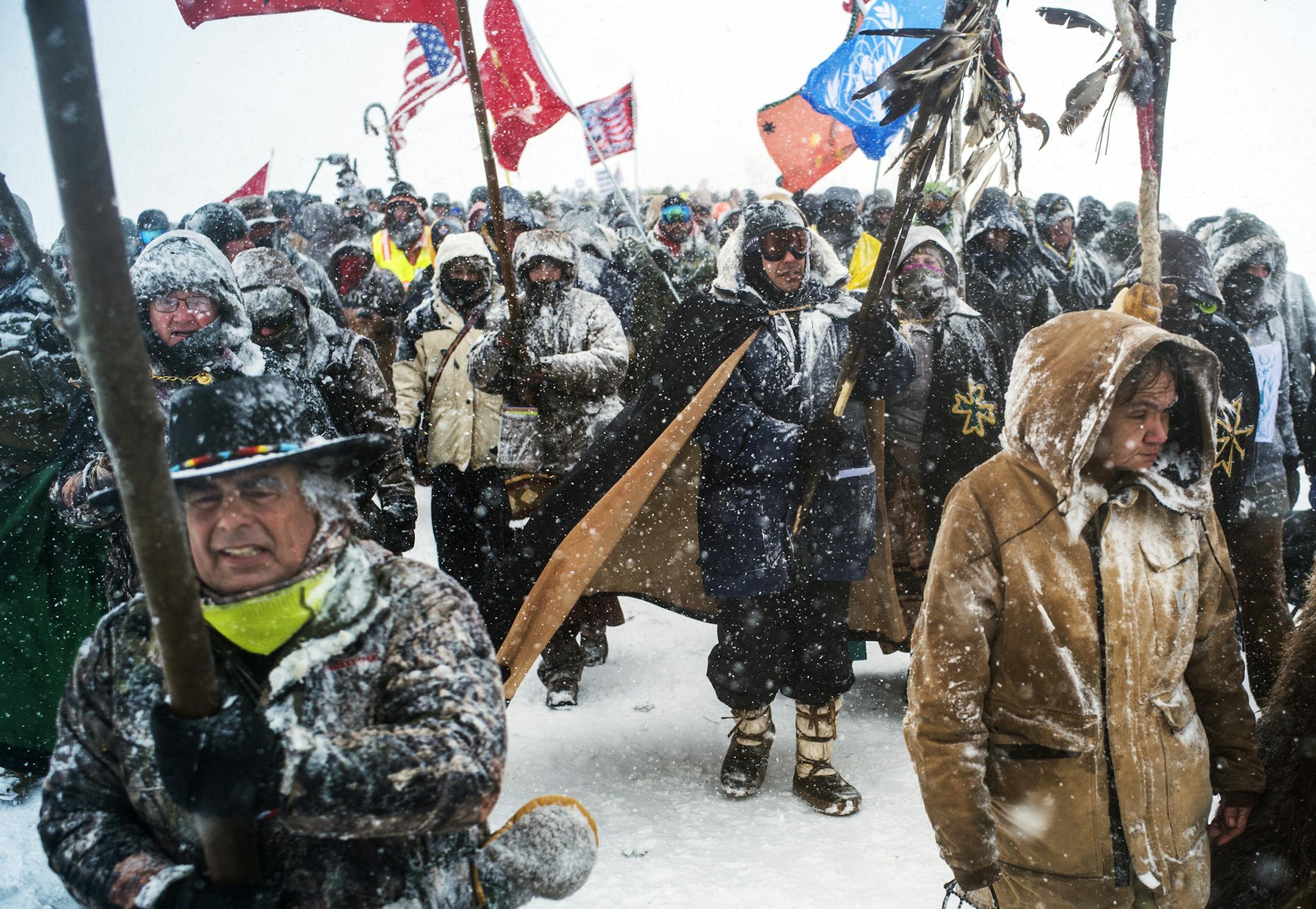 Veterans marched to a blockaded bridge leading to the pipeline site.