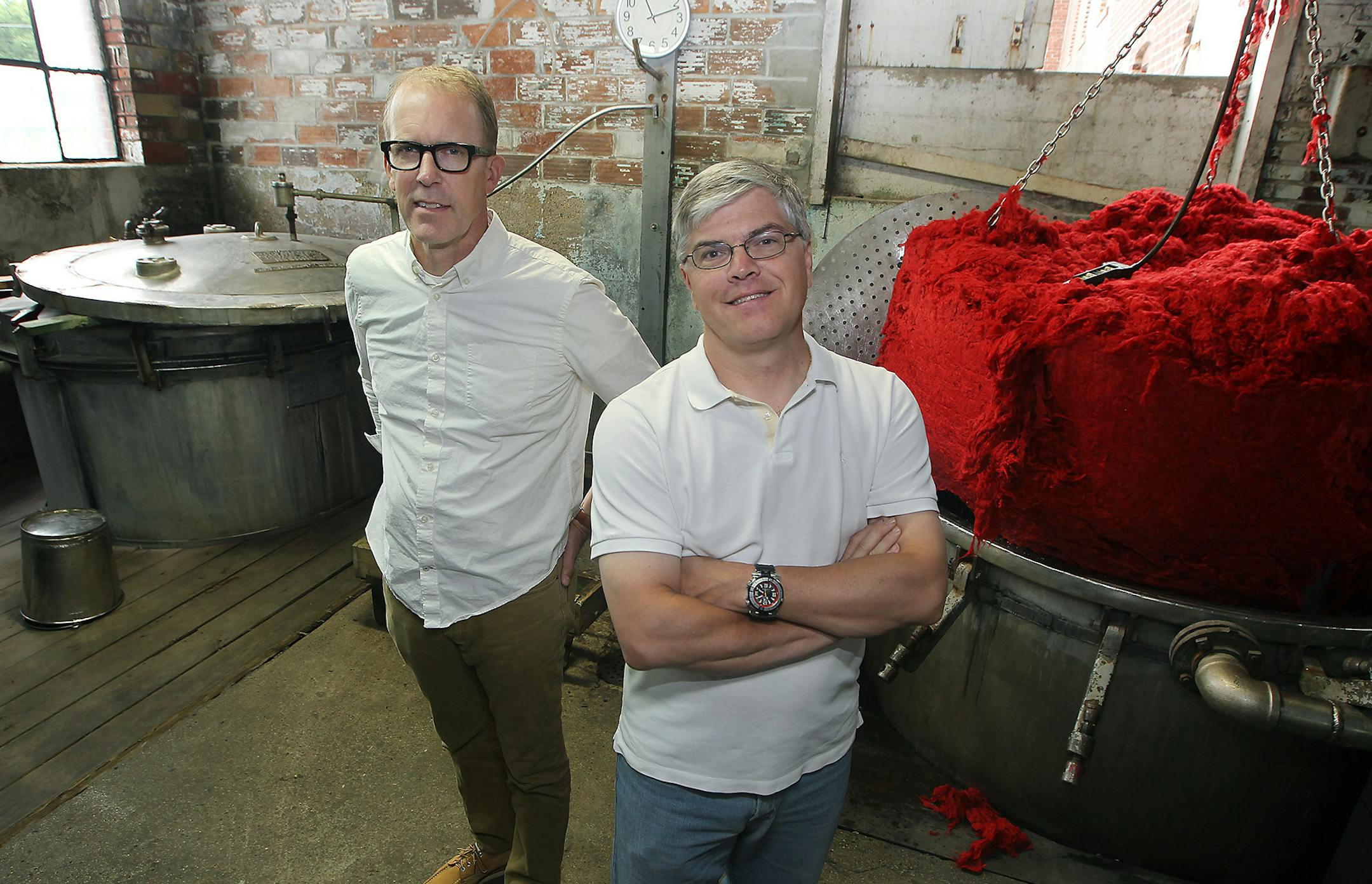 Chief Marketing Officer Bruce Bildsten, left, and investor Paul Mooty, right, at the Faribault Woolen Mill, Thursday, August 6, 2015 in Faribault, MN. The mill is celebrating its 150th anniversary. It started during the Civil War. ] (ELIZABETH FLORES/STAR TRIBUNE) ELIZABETH FLORES • eflores@startribune.com