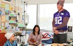Vikings Kyle Rudolph along with other players visit with families at Children&#xed;s Hospital.
