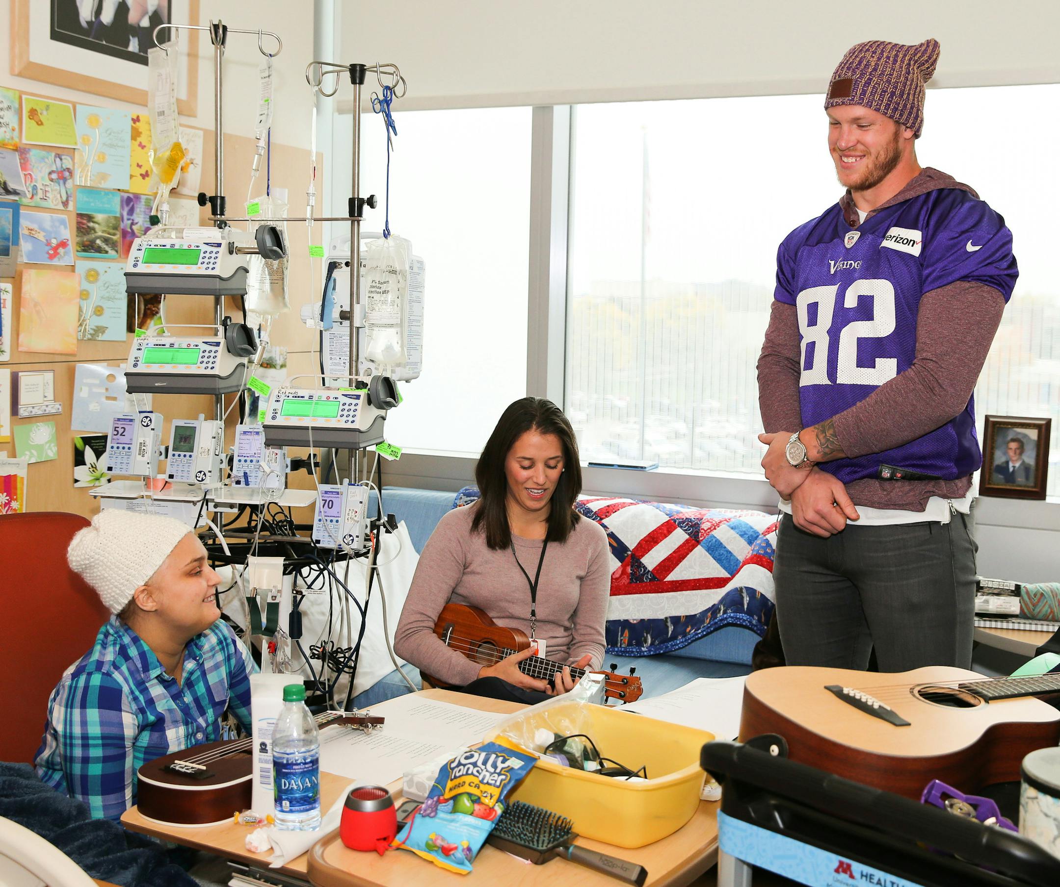 Vikings Kyle Rudolph along with other players visit with families at Childrenís Hospital.