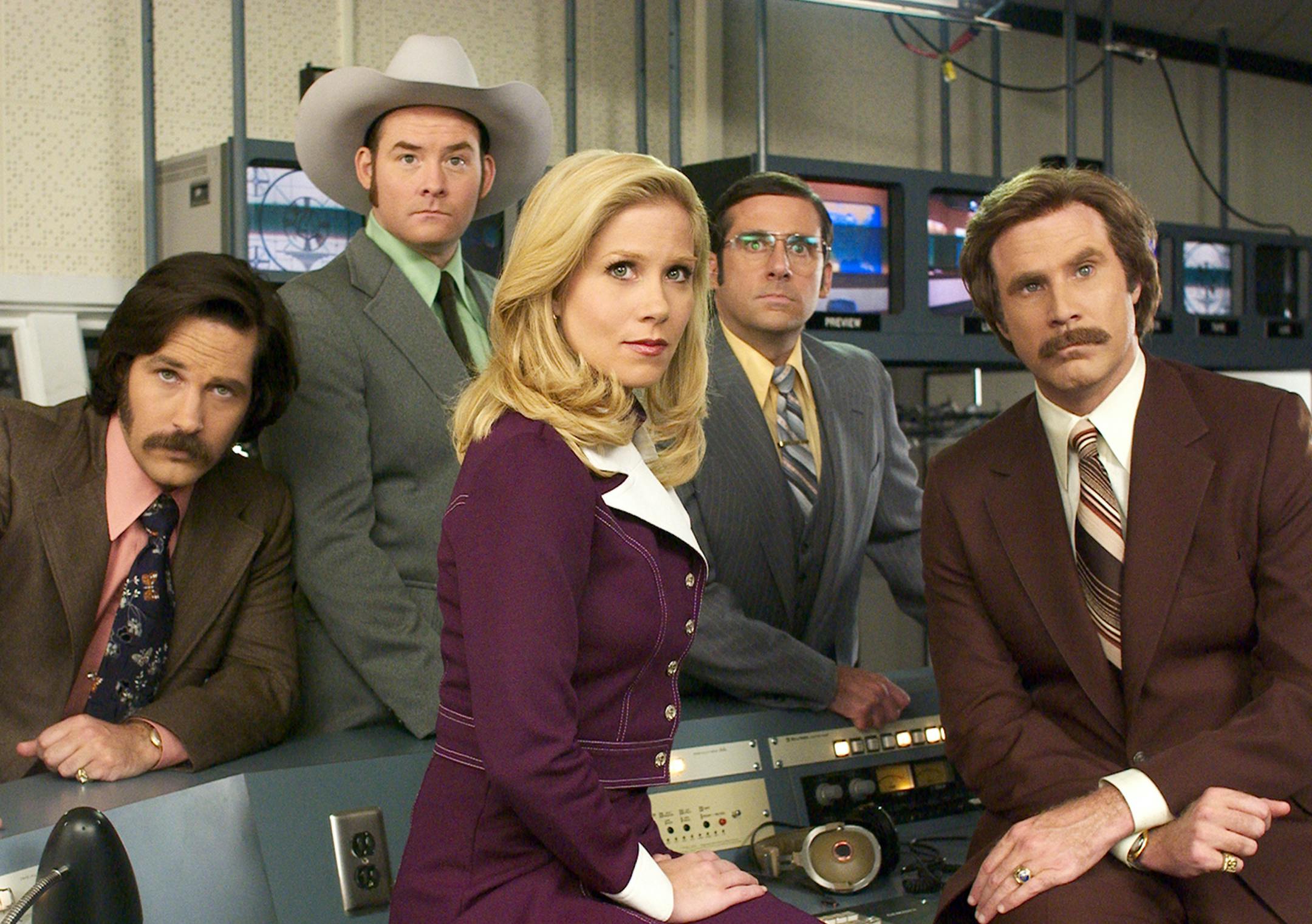 Photo by Darren Michaels... ßVeronica Corningstone (CHRISTINA APPLEGATE, seated center) is the newest addition to the Channel 4 news team, much to the consternation of lead anchor, Ron Burgundy (WILL FERRELL, far right) and his fellow anchor-men, (left to right) Brian Fantana (PAUL RUDD) Champ Kind (DAVID KOECHNER) and Brick Tamland (STEVE CARELL), in DreamWorks PicturesÌ comedy ANCHORMAN: THE LEGEND OF RON BURGUNDY. ORG XMIT: MIN2013031114094739