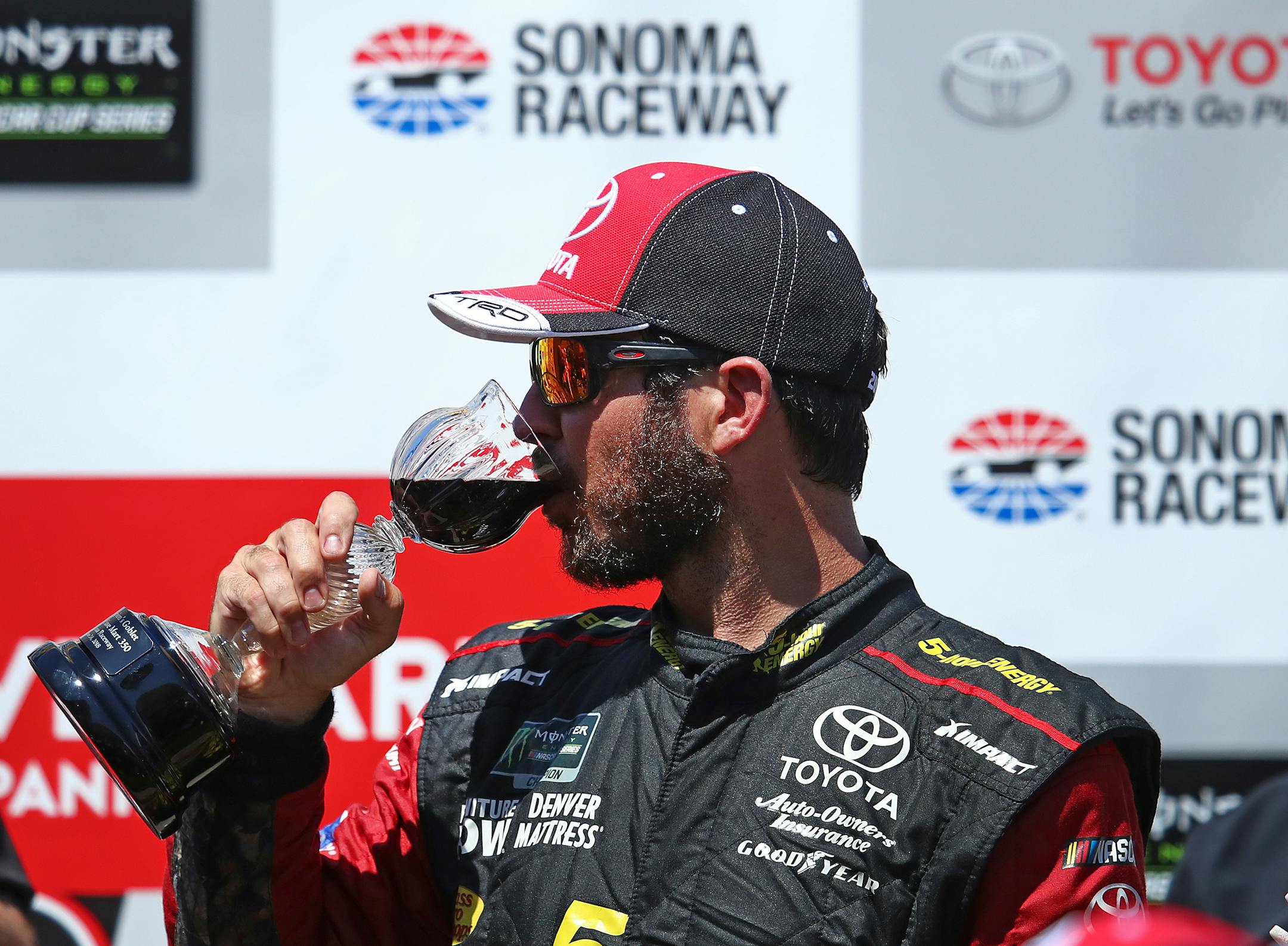 Martin Truex Jr. drank wine after winning a NASCAR Sprint Cup Series race Sunday in Sonoma, Calif.