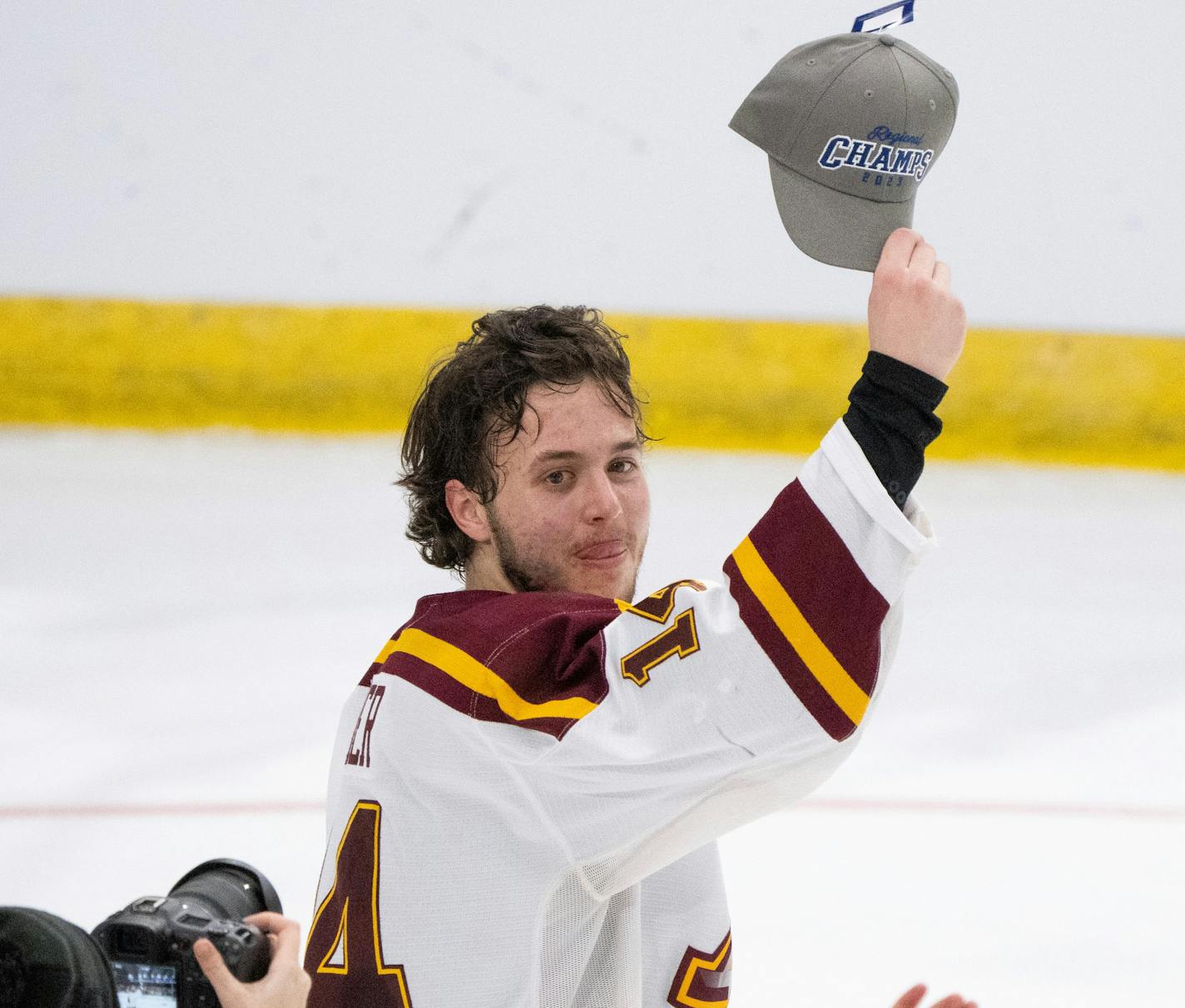 Minnesota Gophers defenseman Brock Faber (14) held up his regional champion's hat after the win over the Huskies. The University of Minnesota Gophers defeated the St. Cloud State Huskies 4-1 in an NCAA Division I Men's Ice Hockey Championship second round game Saturday night, March 25, 2023 at Scheels Arena in Fargo, North Dakota. ] JEFF WHEELER • jeff.wheeler@startribune.com