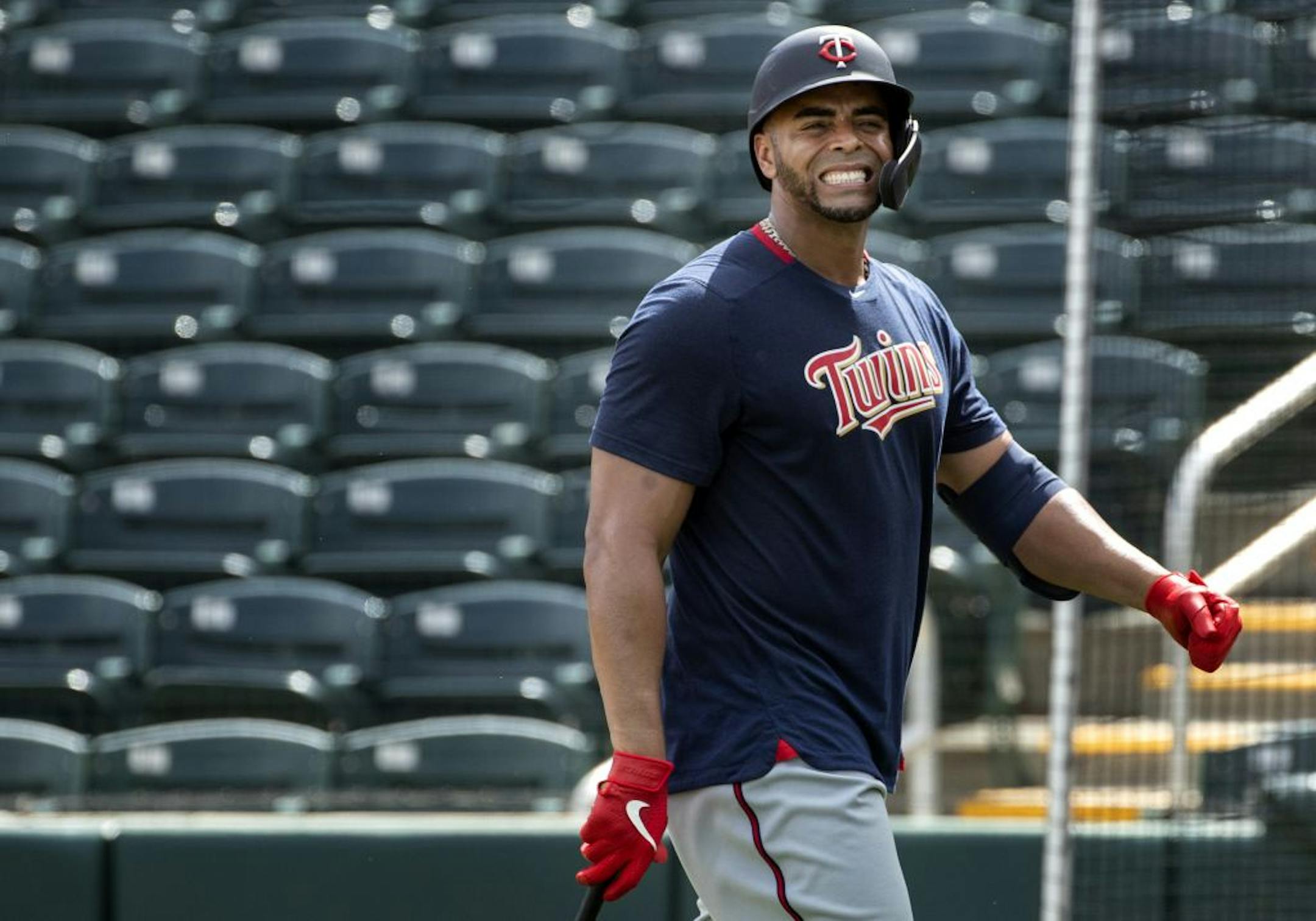 Minnesota Twins DH Nelson Cruz walked back to the dugout after being hit by a pitch during live batting practice.