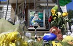 A memorial to three-year-old Evan Brewer sits in front of a home in Wichita, Kan., Wednesday, Sept. 6, 2017. A boy, whose body was found encased in co