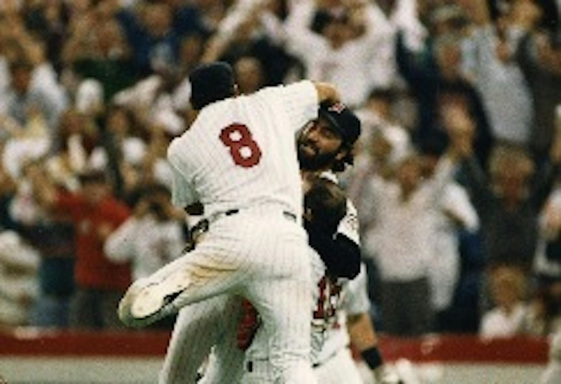 Third baseman Gary Gaetti (8) jumped on closer Jeff Reardon after the final out of Game 7 of the 1987 World Series, as the Twins beat the Cardinals for their first baseball title.