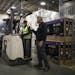 Rob Bass, Best Buy's Chief Supply Chain Officer, visited with Todd Lothert while leading a tour of the company's Bloomington distribution center Monda