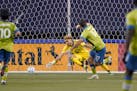 Seattle Sounders forward Will Bruin (17) watches his shot go past Minnesota United goalkeeper Dayne St. Clair as he scores during the second half of a