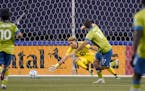 Seattle Sounders forward Will Bruin (17) watches his shot go past Minnesota United goalkeeper Dayne St. Clair as he scores during the second half of a