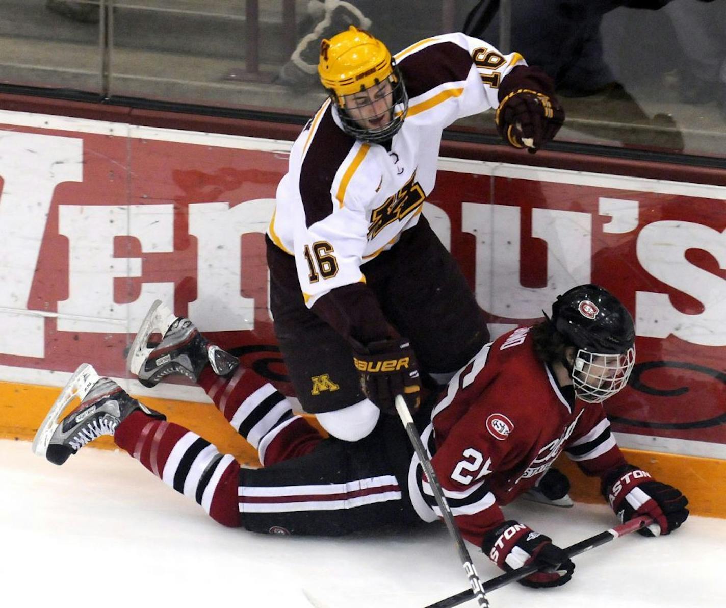 Minnesota's Nate Condon, top, and St. Cloud State's Nic Dowd collided in the second period.