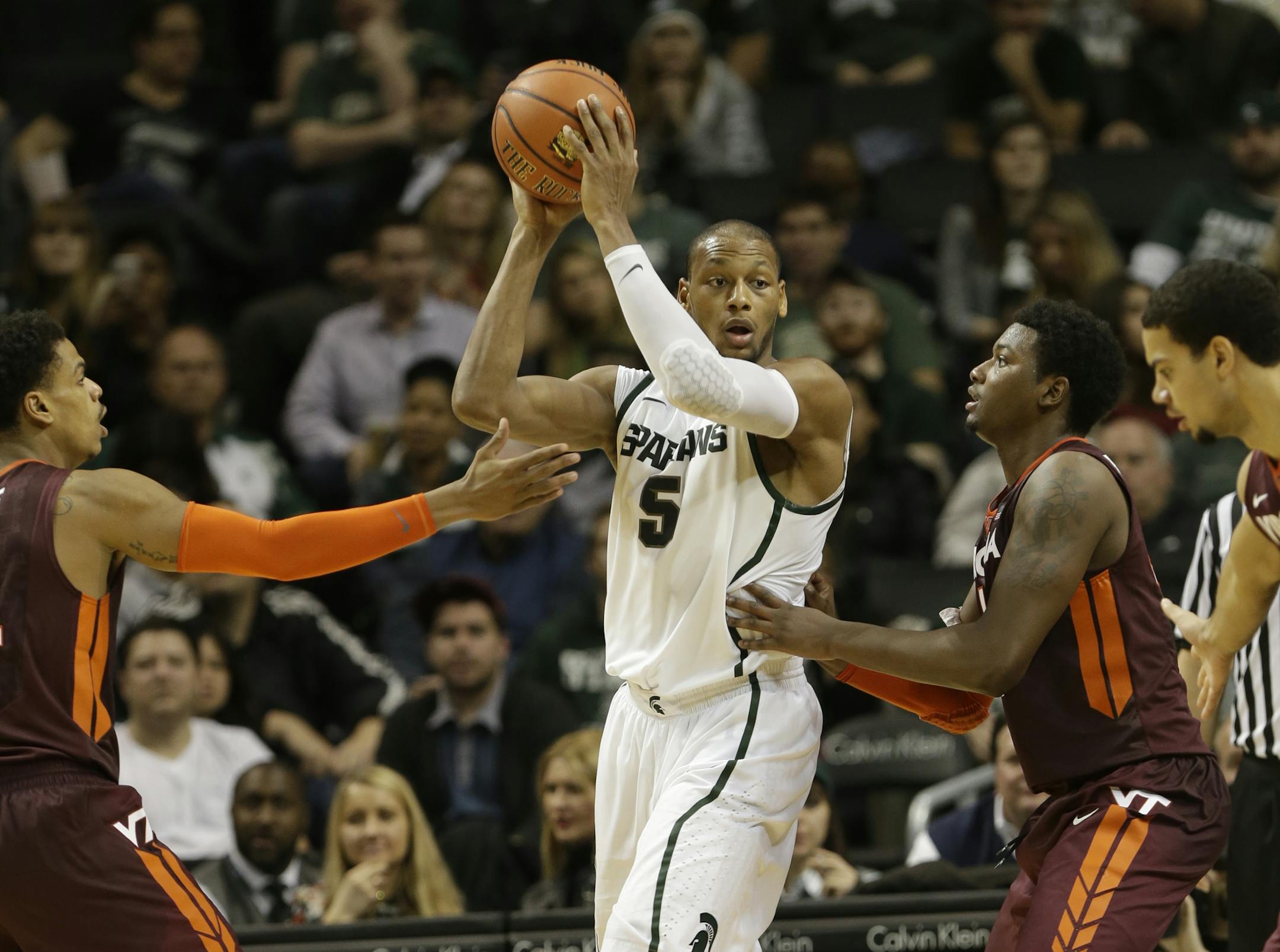 Michigan State's Adreian Payne (5) looks to pass during the second half of a Coaches vs. Cancer NCAA basketball game against the Virginia Tech Saturday, Nov. 23, 2013, in New York. (AP Photo/Frank Franklin II)