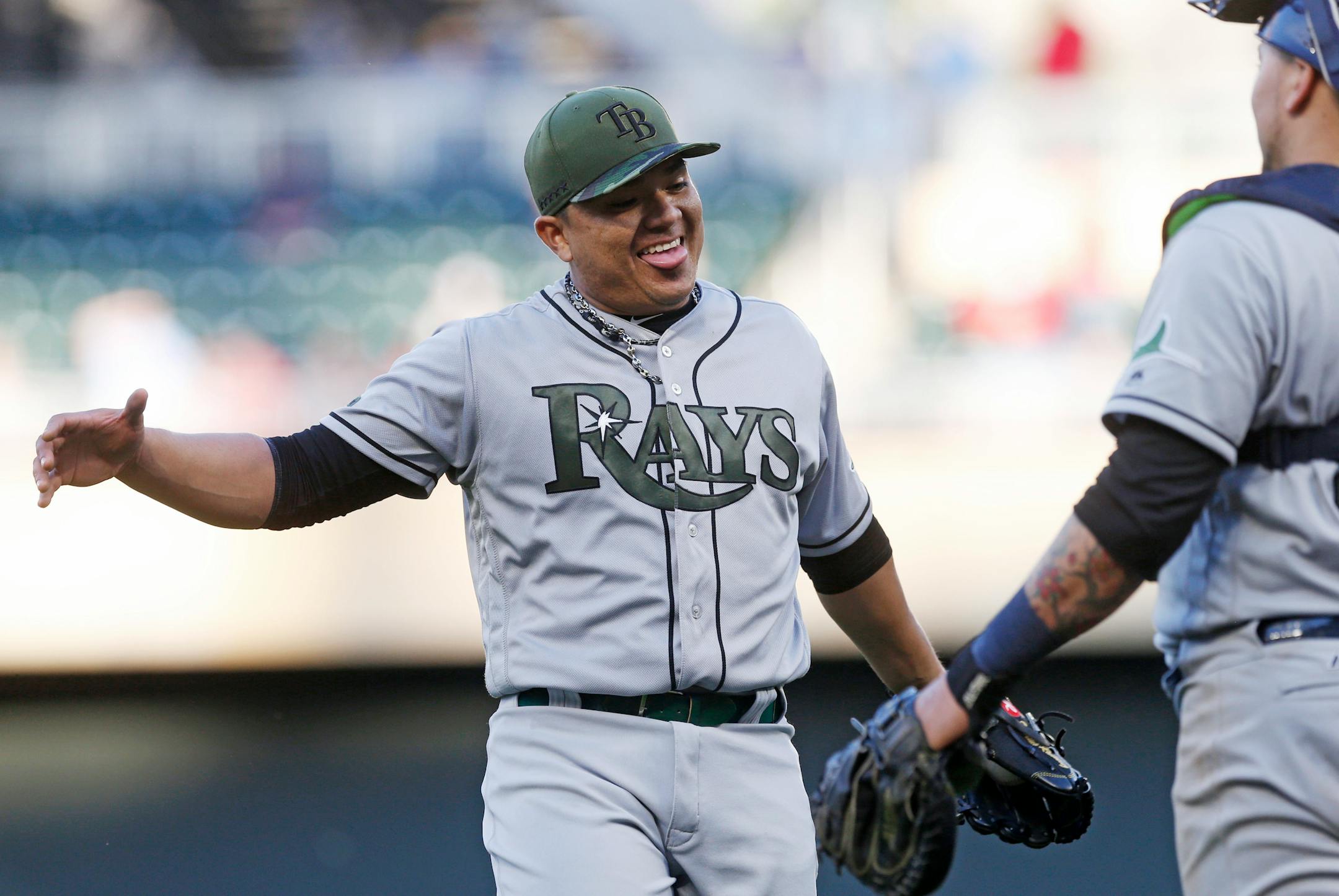 Tampa Bay Rays relief pitcher Erasmo Ramirez celebrates the final out with catcher Jesus Sucre after the Rays beat the Minnesota Twins 8-6 in 15 innings of a baseball game Sunday, May 28, 2017 in Minneapolis. Ramirez got the save. (AP Photo/Jim Mone)