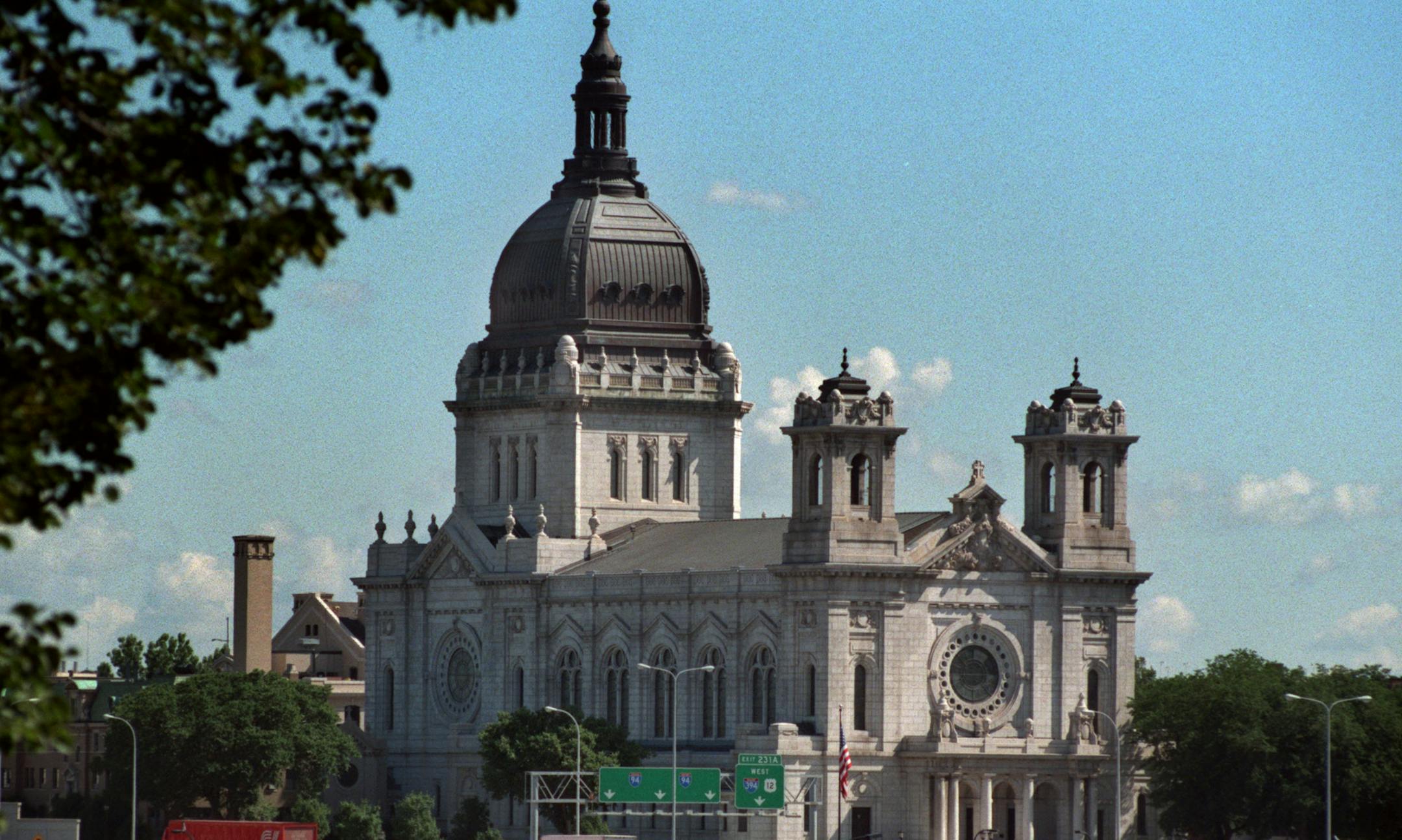 Sunday Afternoon on the Avenue, a tour of five historic places of worship on Hennepin Avenue, will take place on Sunday, August 9. -- The Basilica of Saint Mary, Hennepin Avenue at 16th St. was designed in 1906 by Emmanual Masqueray. It is built of Hardwick granite; the dome is clad in copper. View from Lowry Hill.