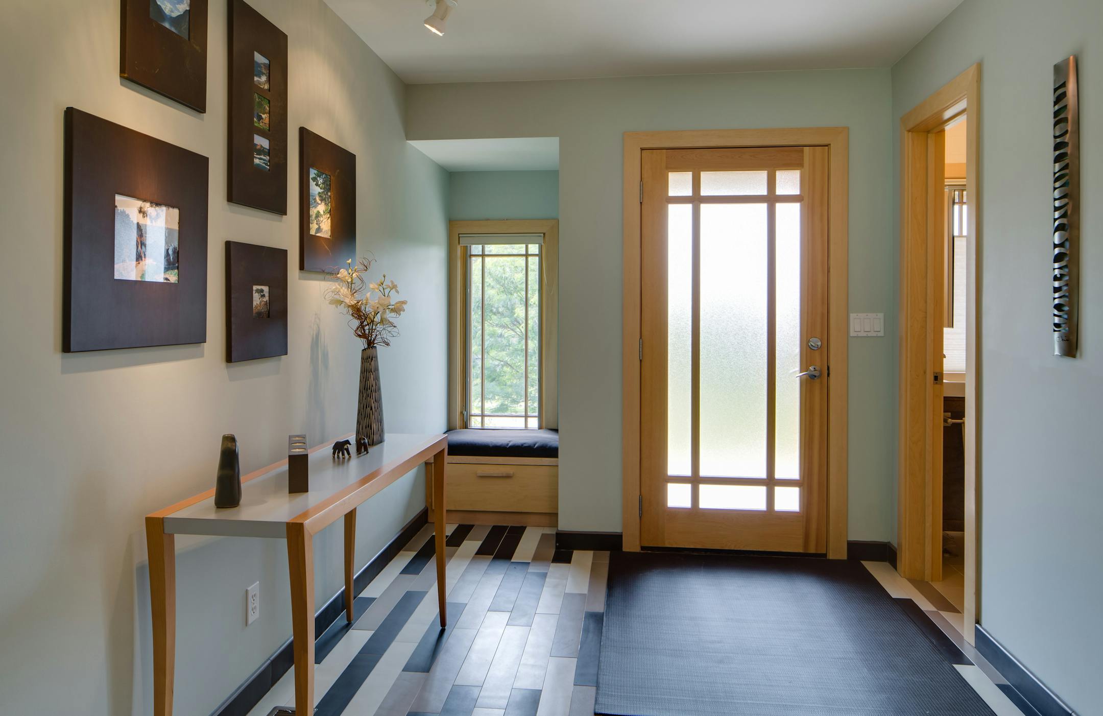 The foyer features Italian porcelain tile flooring.