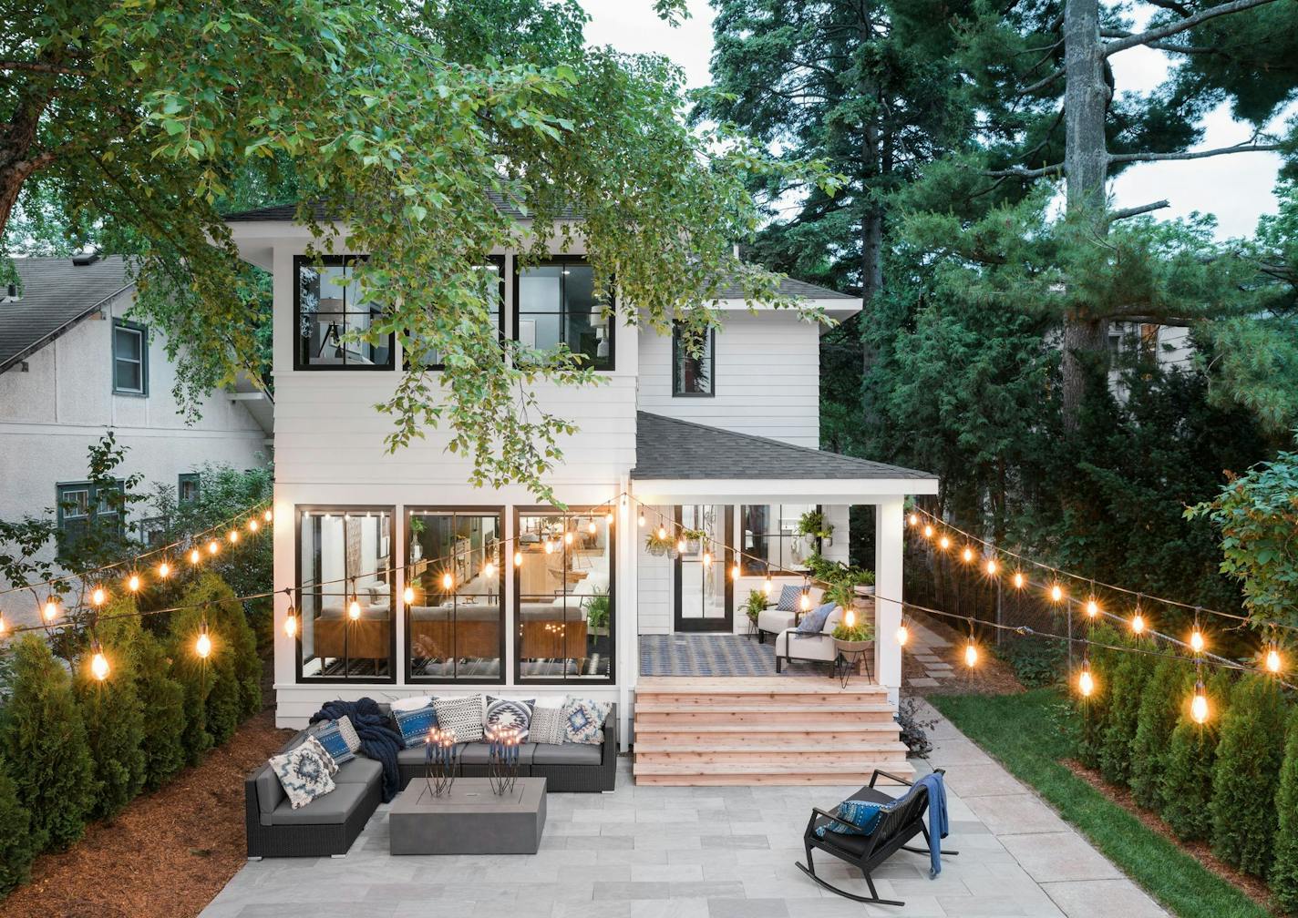 A view of the two-story addition, rear porch and backyard party patio.