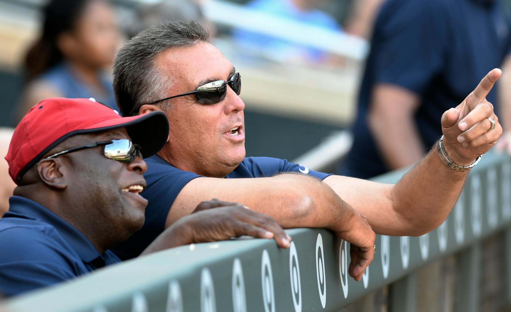 Former Minnesota Twins AL Newman, left, and Kent Hrbek, right, watch a video celebrating the 30-year anniversary of 1987 Twins' World Series championship, before the Twins' baseball game against the Detroit Tigers on Saturday, July 22, 2017, in Minneapolis. The 1987 team was honored before the game. (AP Photo/Tom Olmscheid)