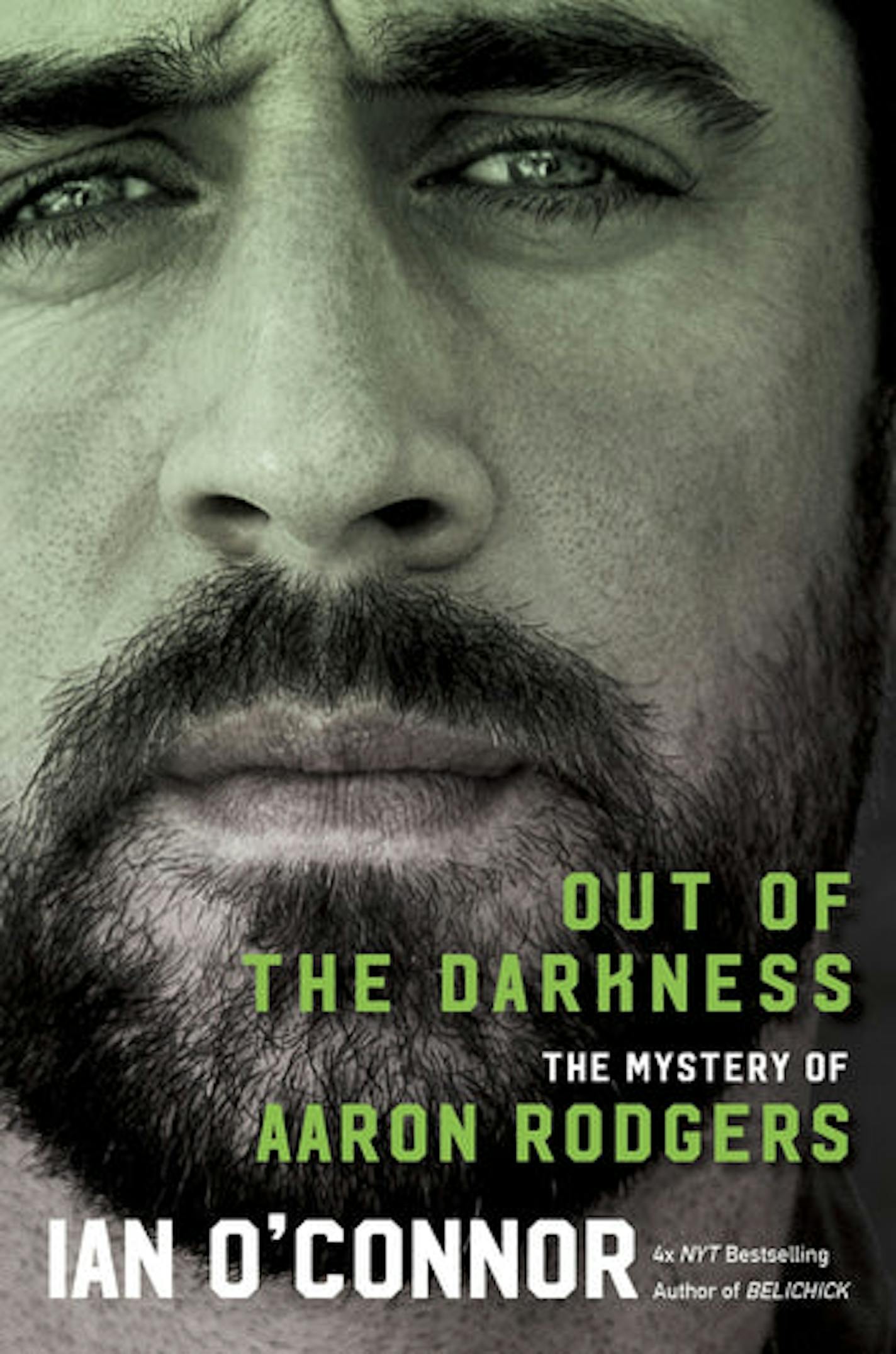 cover of Out of the Darkness is a green-tinted close up of Aaron Rodgers