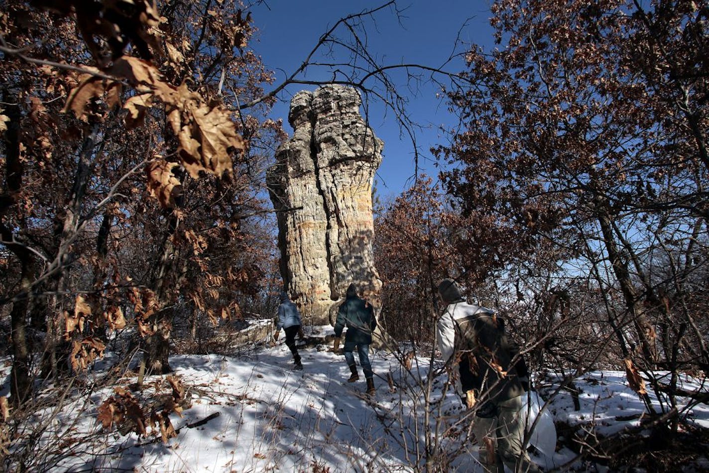 Members and guests of the Hastings Environmental Protectors hiked near the Chimney Rock in Marshan Township as they looked for birds and as they also cleaned up the area.