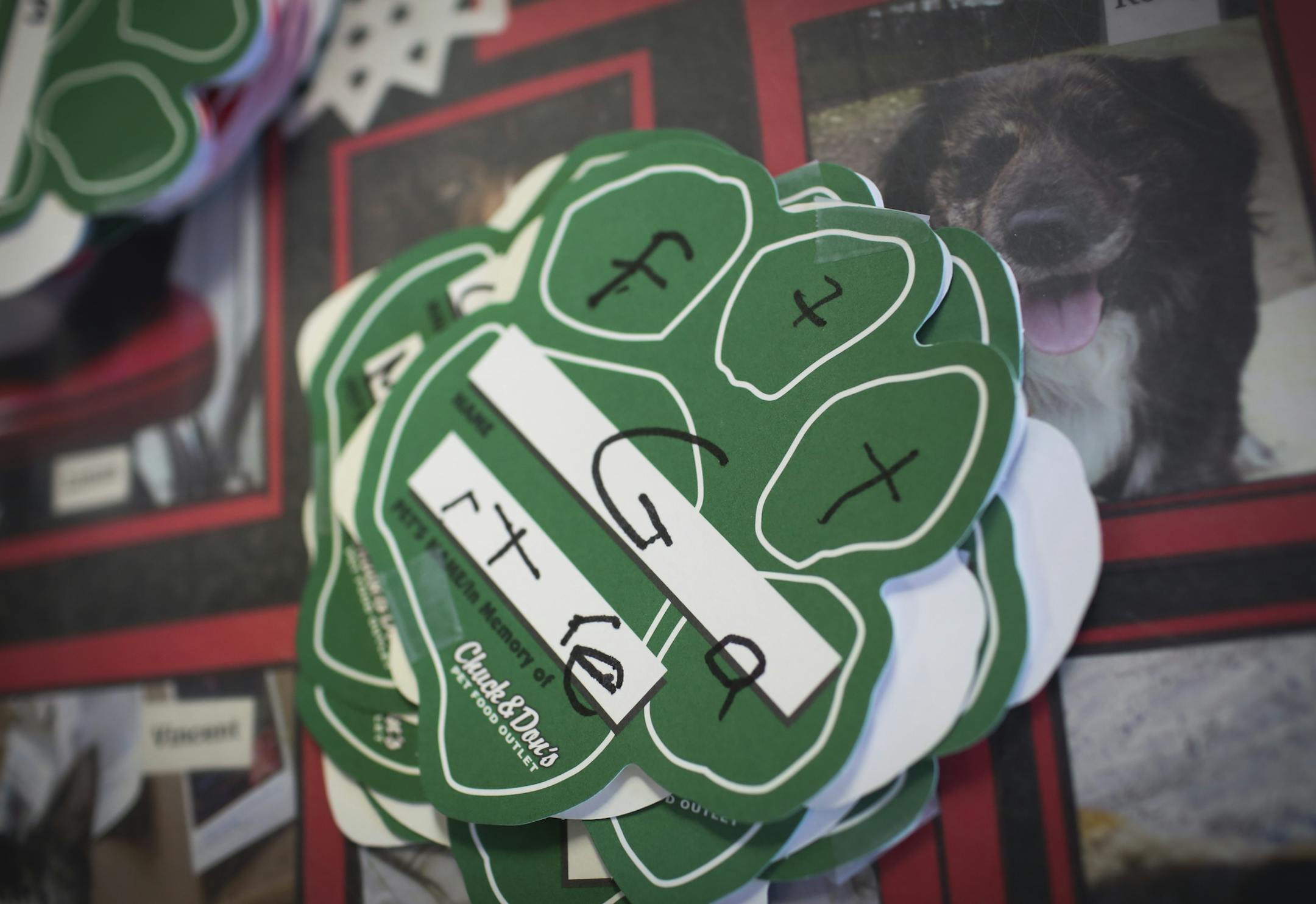 A paw print fundraising card written by a child at Chuck and Don's Pet Food and Supplies in Minneapolis, Minn. on Friday, December 19, 2014. ] REN&#xc9;E JONES SCHNEIDER reneejones@startribune.com