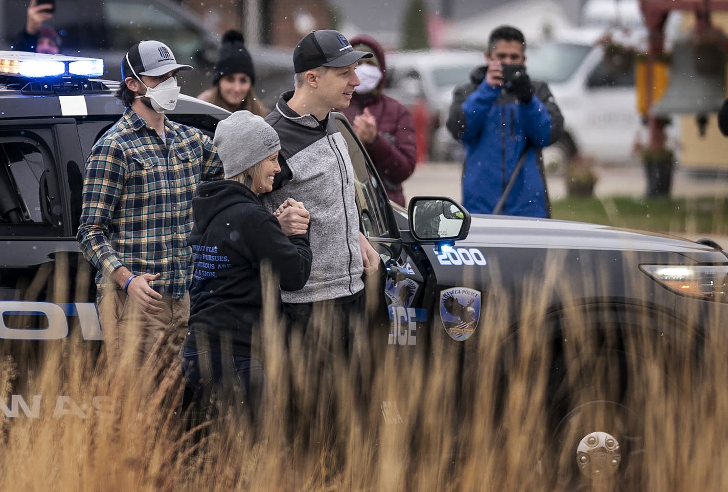 Officer Arik Matson and his wife, Megan, arrive at the Waseca Public Safety building as he returned home for the first time since he was shot in the line of duty on January 6th.