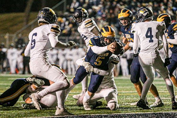 Rosemount's Landon Danner stretched for the end zone, breaking the plane for a first-quarter touchdown against Prior Lake. Rosemount led 14-12 at the 