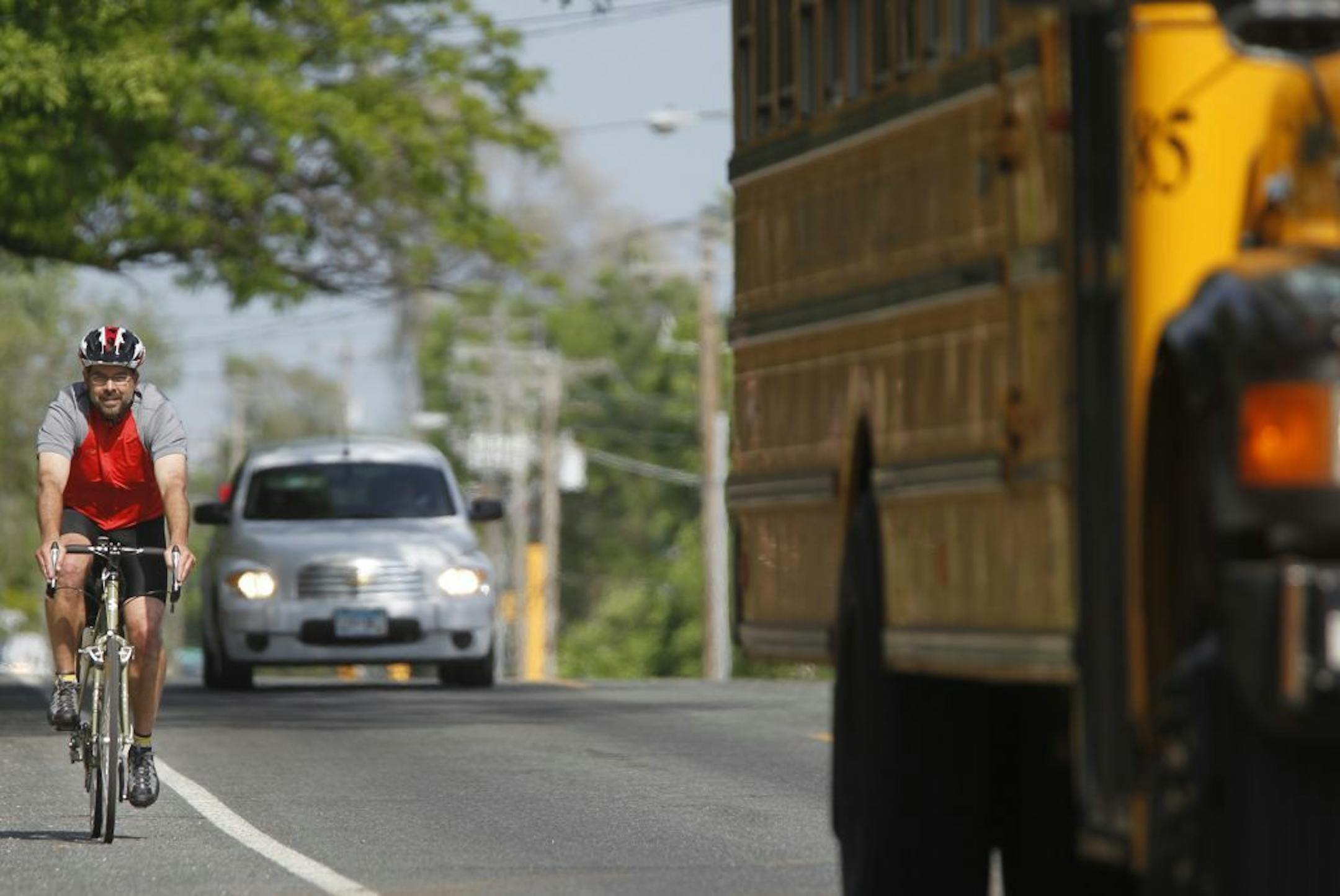 Near W. 86th St. West and Emerson Ave. S., Michael Hanson rides to his home in Eden Prairie.