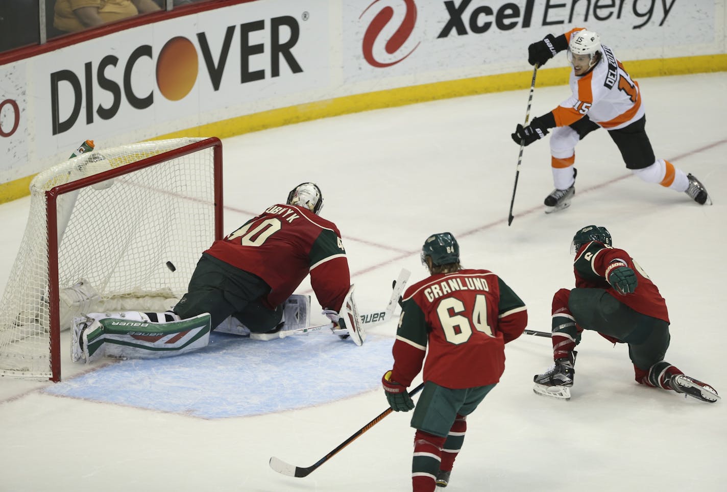 Philadelphia Flyers defenseman Michael Del Zotto (15) slipped the puck between Wild goalie Devan Dubnyk and the pipe for the game-winning goal in the overtime period Thursday night.