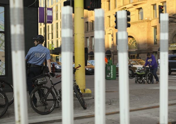 A Minneapolis police bike patrol officer stood near the intersection of 5th Street and Hennepin Avenue downtown in 2017.