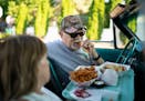 Ralph Stinger bit into his first French fry while dining in his '64 Ford Galaxie 500 with his wife, Bobbi, at Clays Galaxy Drive In.